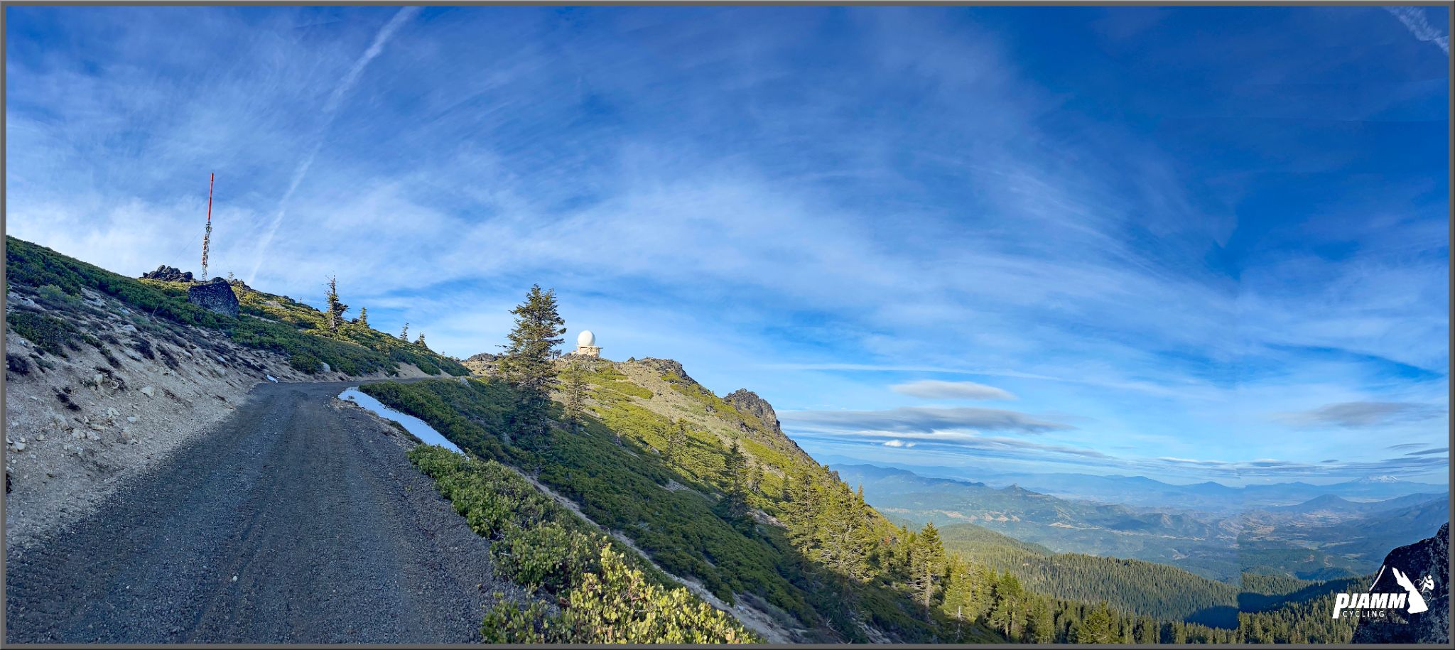 Cycling Mt. Ashland, Oregon via Loop Road: narrow gravel road approaching the summit of Mt. Ashland, National Weather Service dome in distance