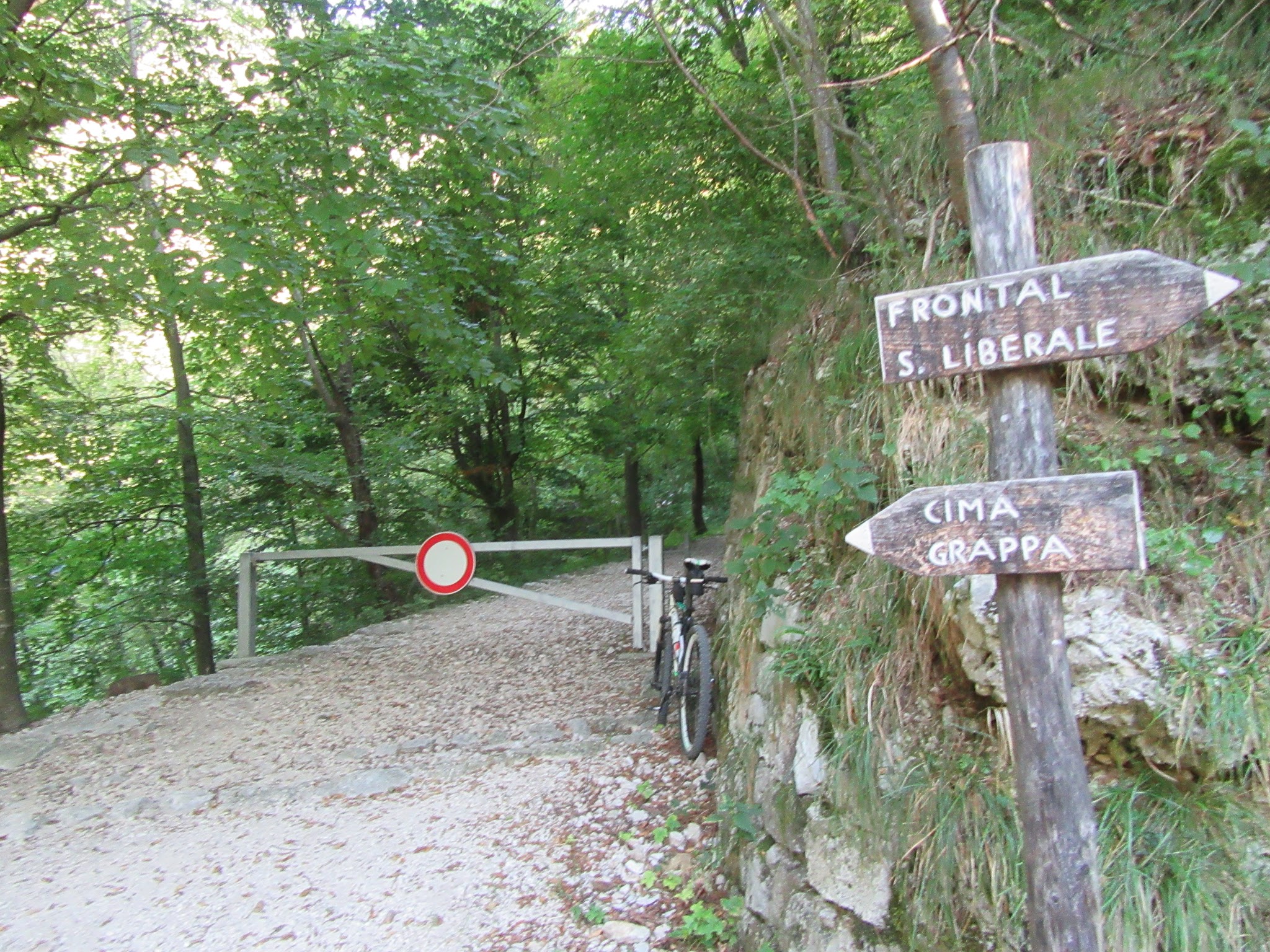 Bicycle climb of Monte Grappa from Crespano - start of gravel - gate, bike 