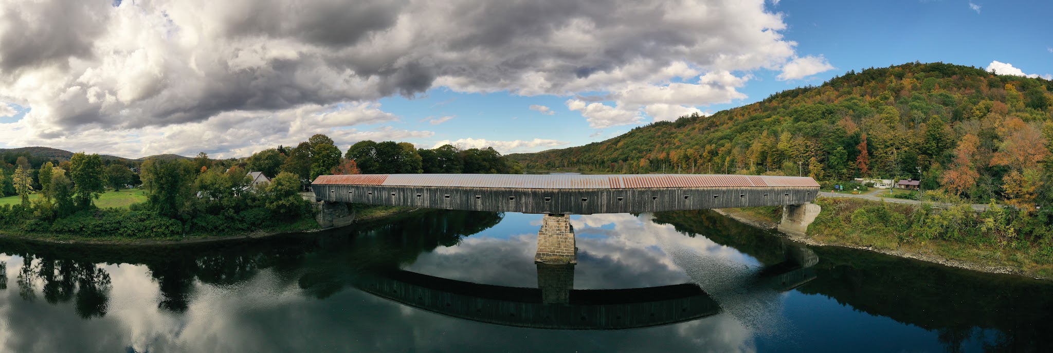 Cycling Mt. Ascutney, Vermont - the Cornish to Windsor historical covered bridge during fall foliage season