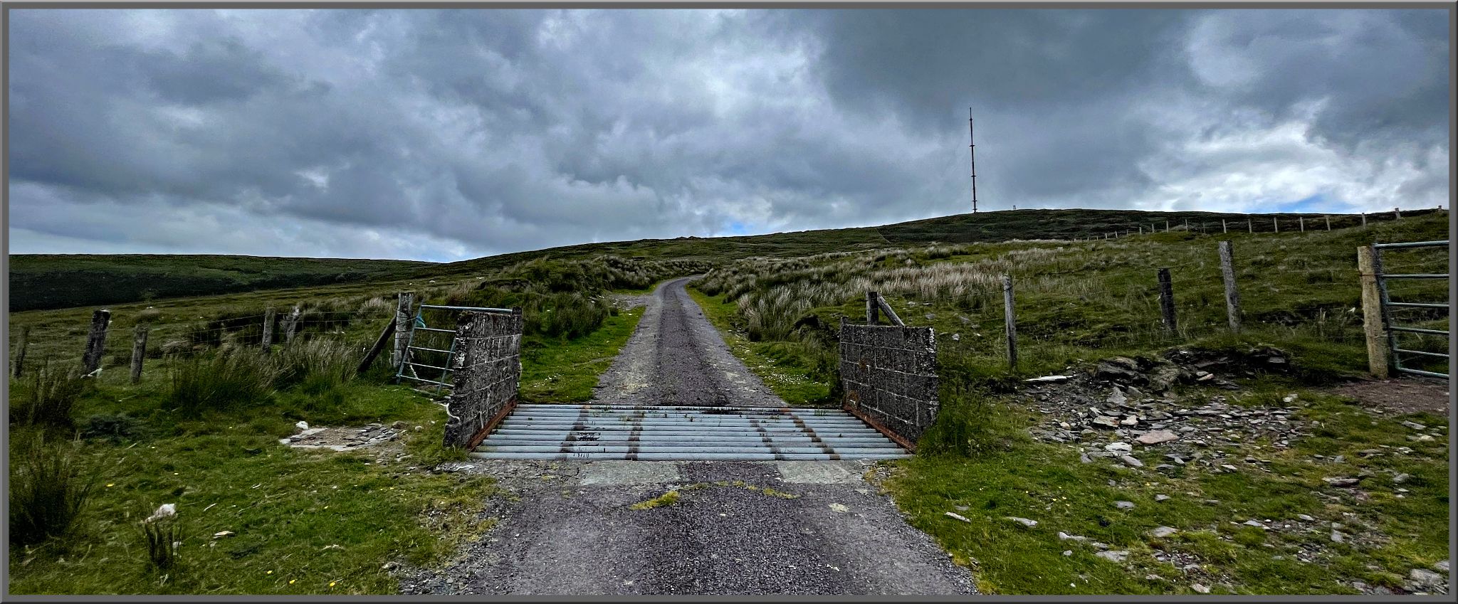 cattle guard over gravel road