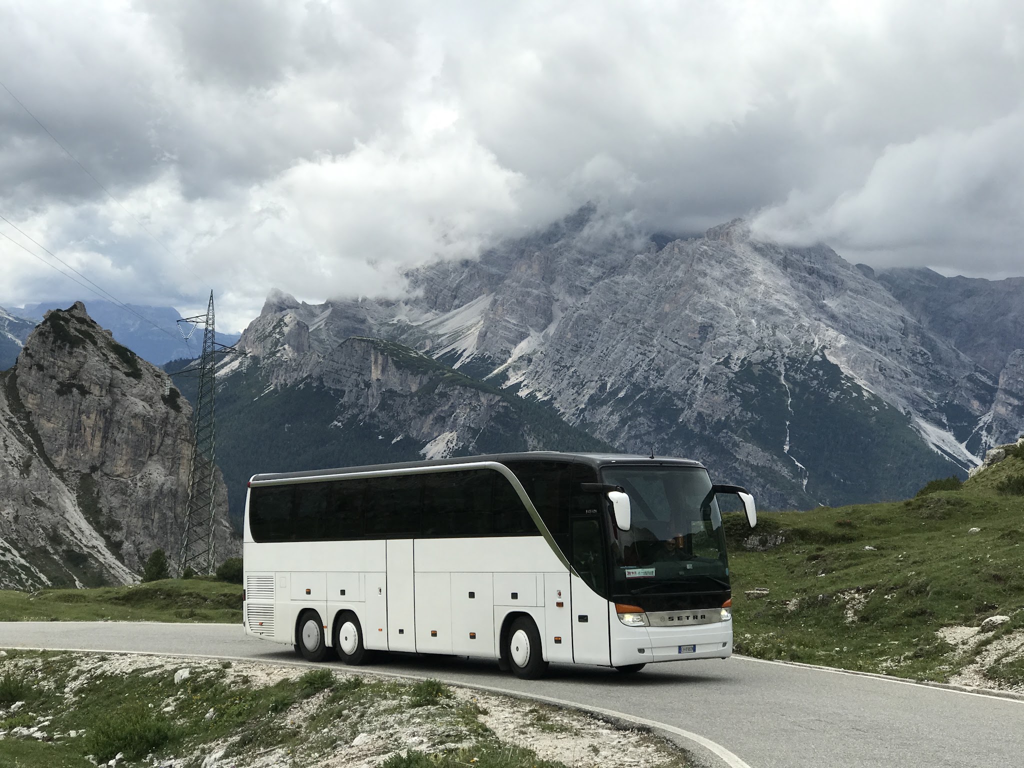 Biking up Tre cime di lavaredo - tour bus on road