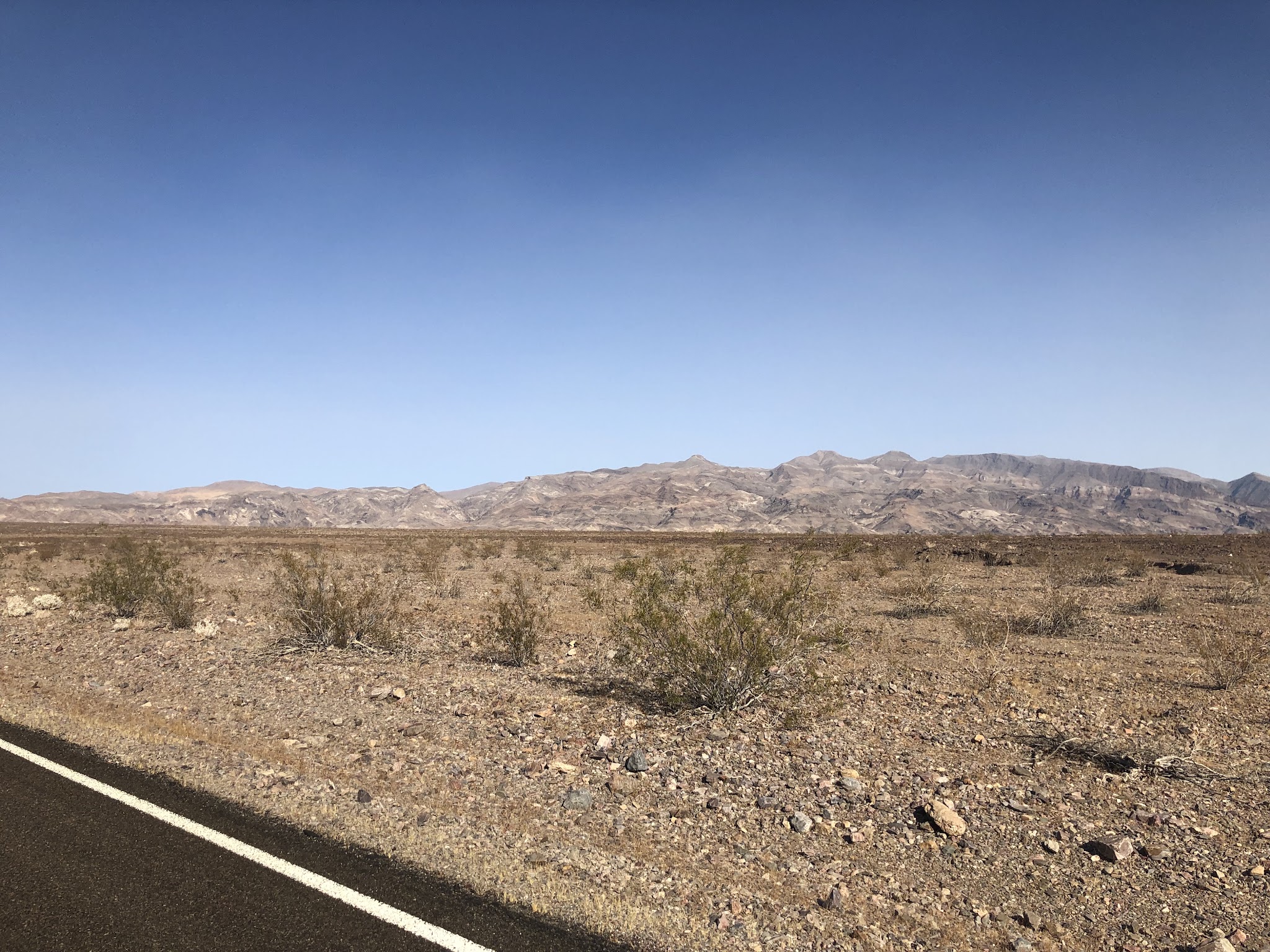 Bike ride Daylight Pass Death Valley - mountains and road