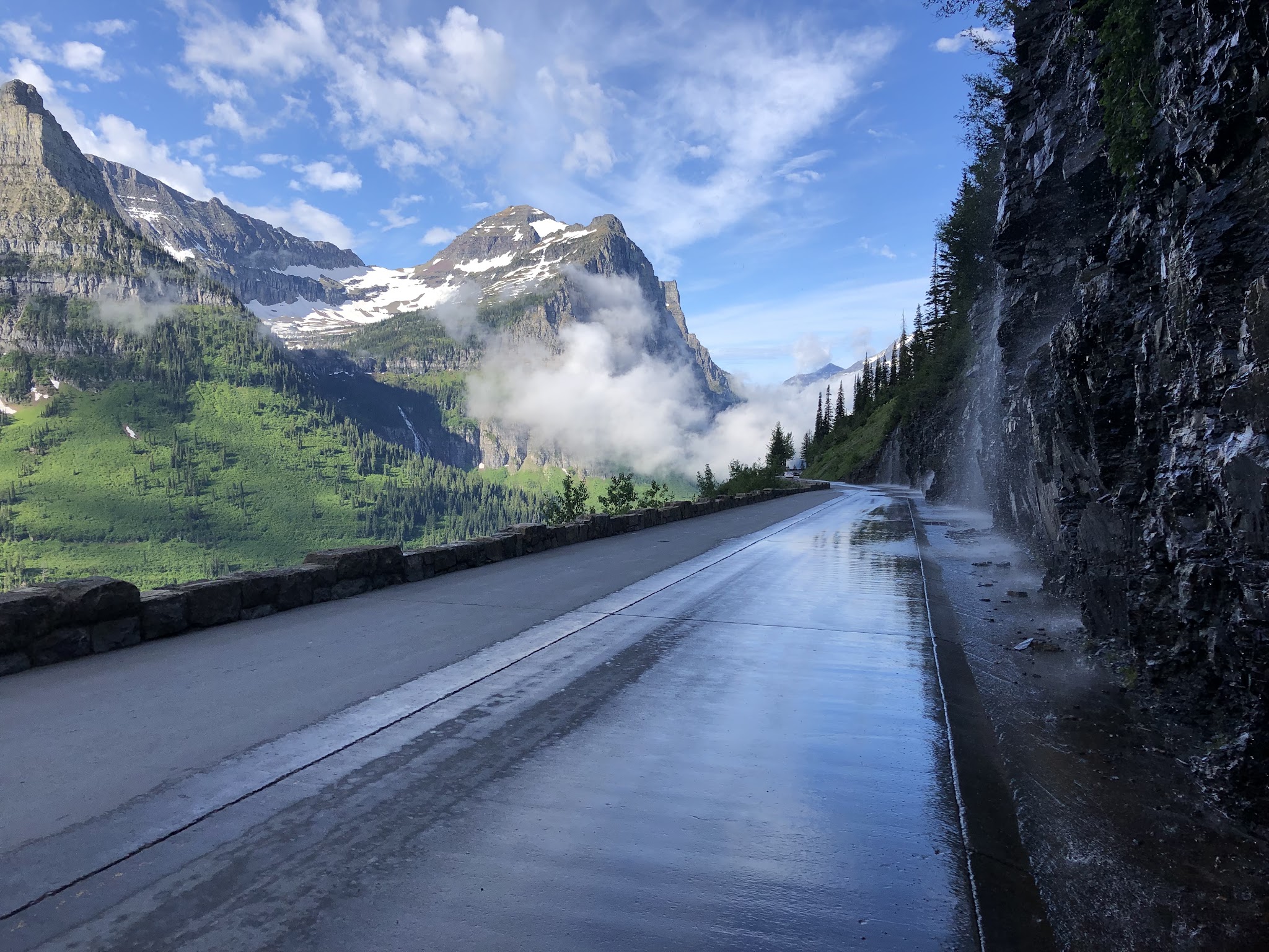Bike climb Going to the Sun Road - Logan Pass - roadway, clouds, mountains
