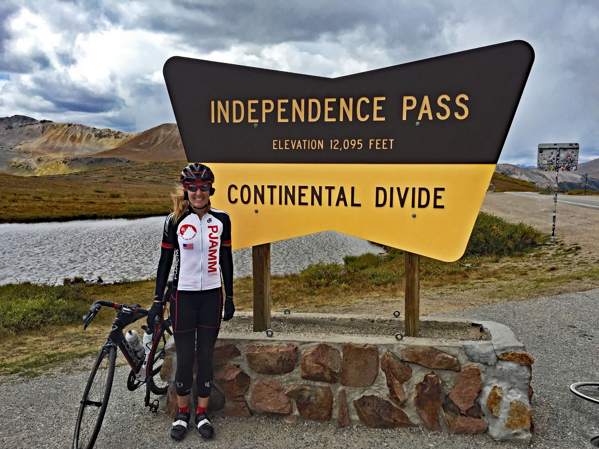 Cycling Independence Pass - summit sign, bike, Stacy Topping, pjamm