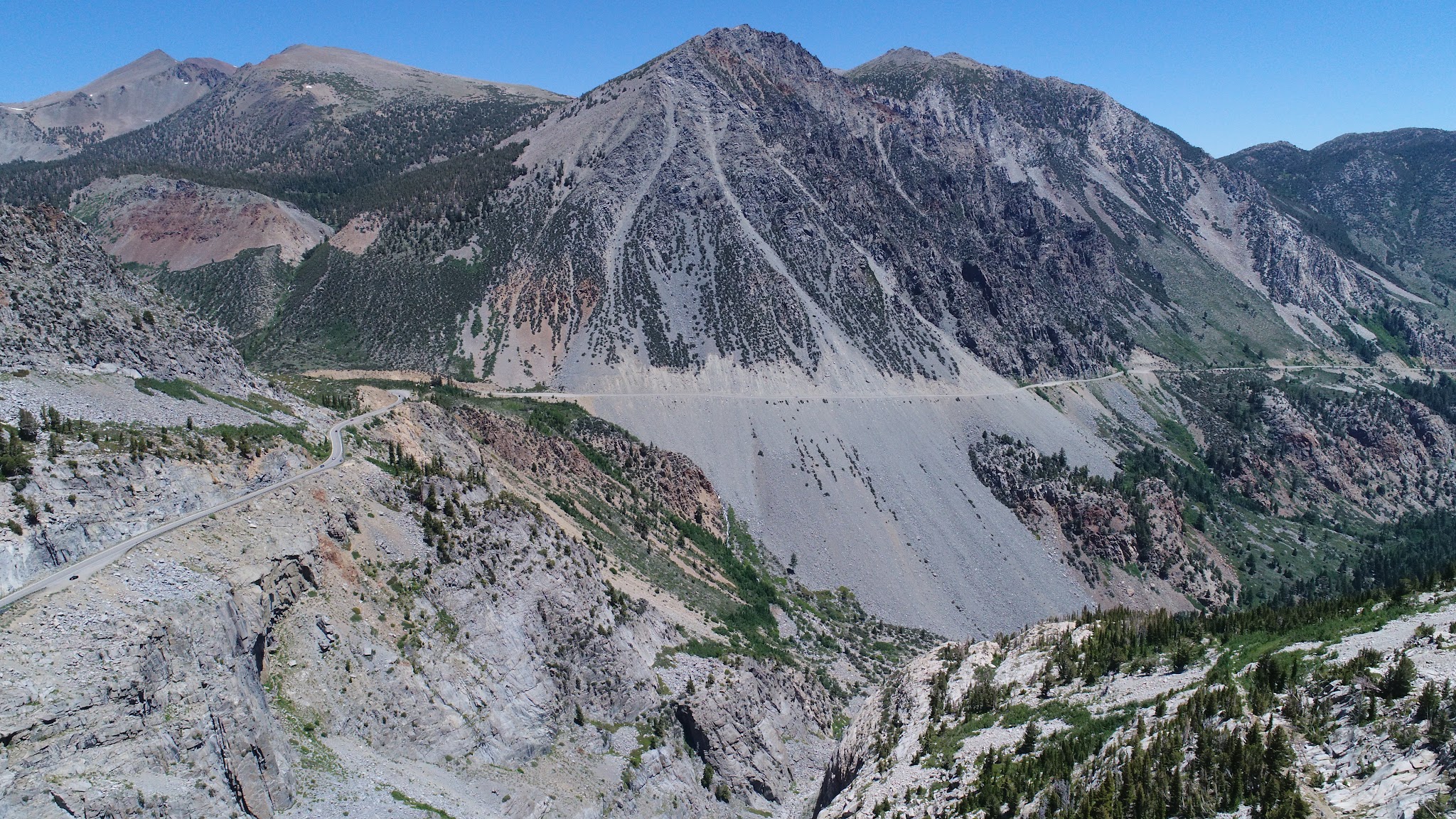 CA Most Epic Bike Climbs - Tioga Pass, roadway, sheer cliff, mountains.