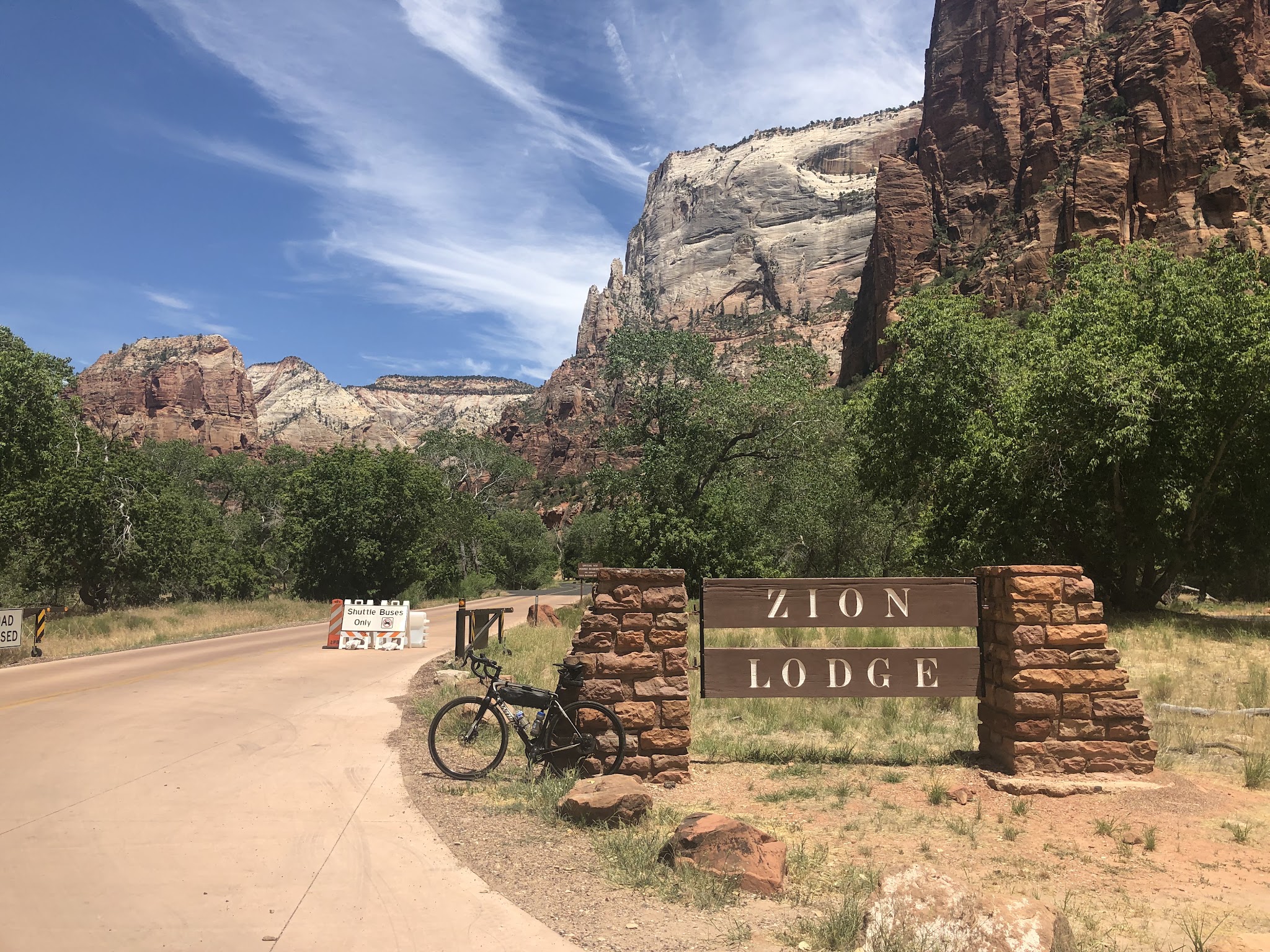 Cycling Zion National Park Cycling Zion National Park - bike next to Zion Lodge sign
