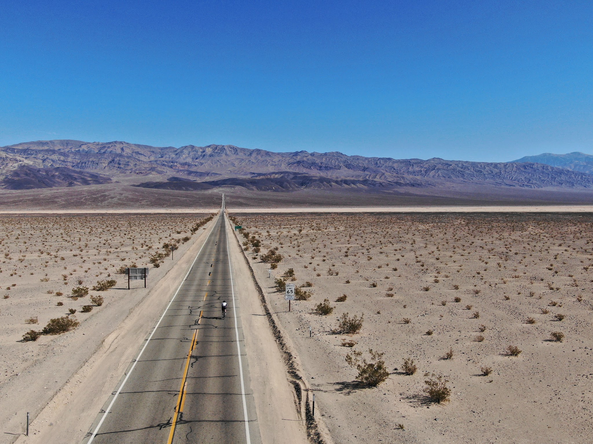 Cycling Death Valley National Park, California Cycling Death Valley National Park, California - long, straight roadway just before the start of Towne Pass West climb