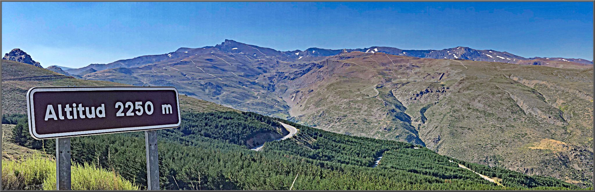 panoramic view of Pico Veleta from Granada, altitude sign reads 2250 m