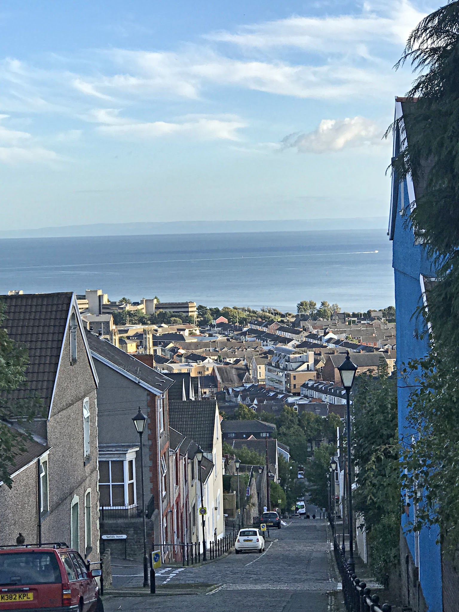 Cycling Constitution Hill, Wales - view from climb's finish of village overlooking Swansea Bay