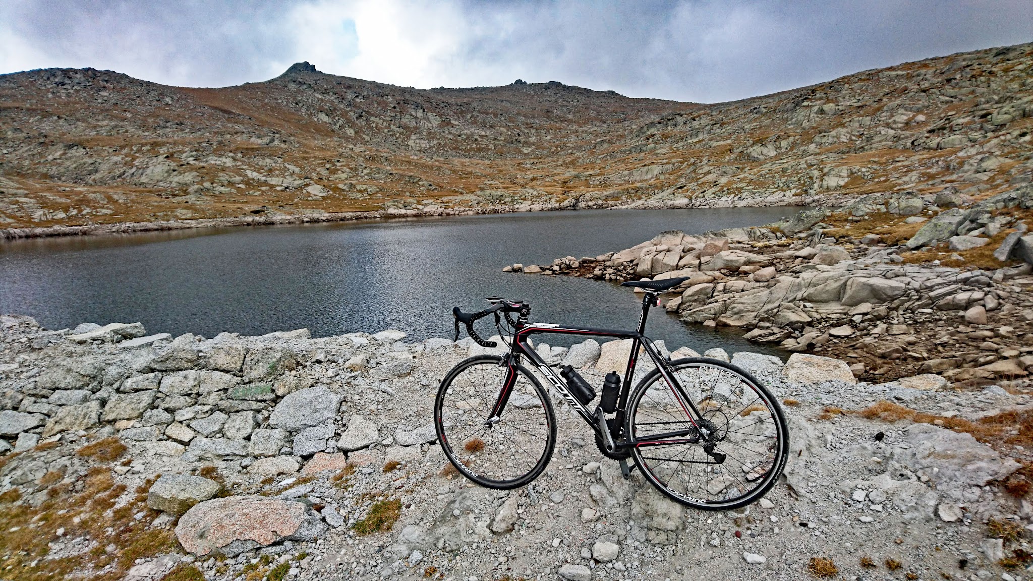 Rila climb by bike - bicycle at dam and reservoir