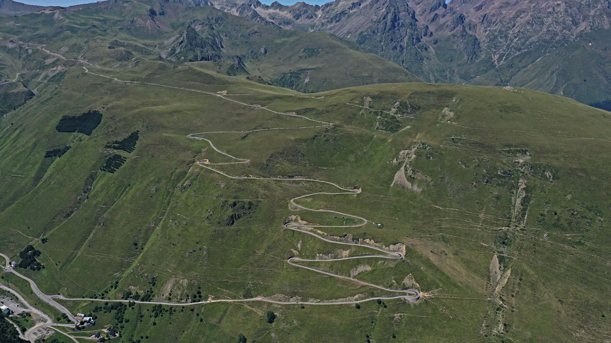 Cycling Col de Portet panoramic view of hairpins snaking up the Pyrenees mountain climb