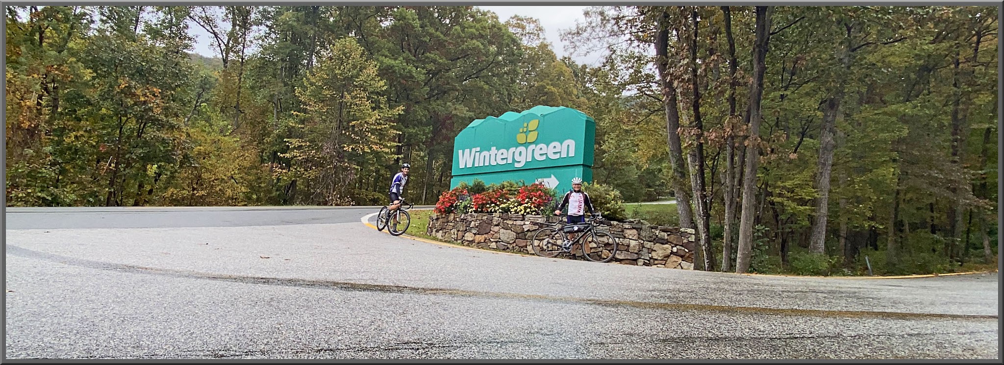 Cycling Wintergreen, Virginia - cyclist riding next to green sign for Wintergreen