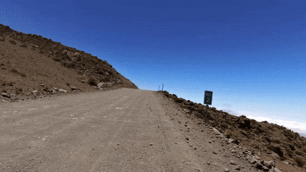 Stacy Topping riding her bike on the Mauna Kea gravel. 