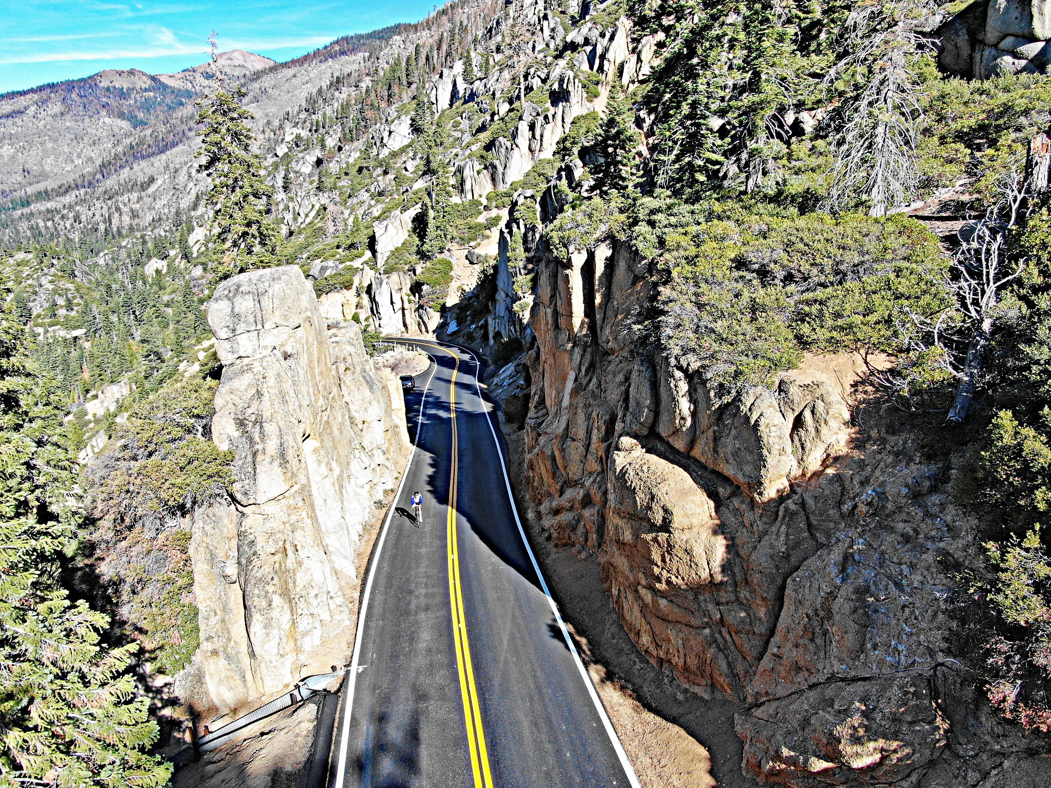 Climbing by bike Sonora Pass West - highway and little pass between rock formations