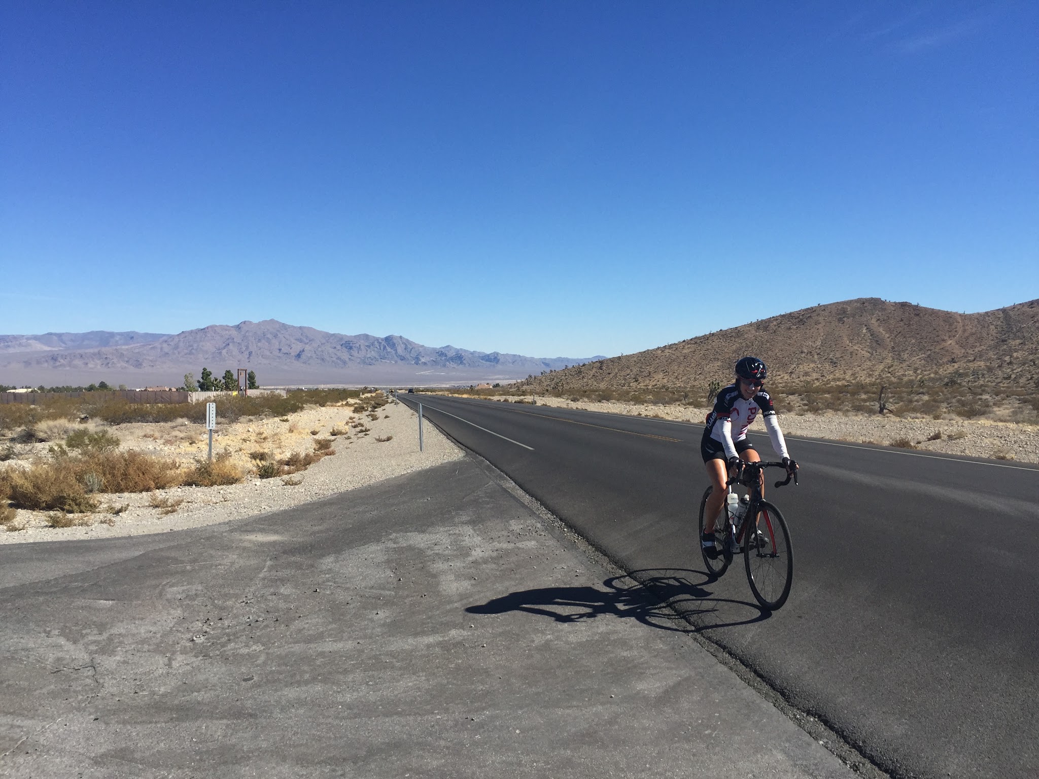 Cyclist riding bike up Kyle Canyon, Hwy 157, to Mt. Charleston.
