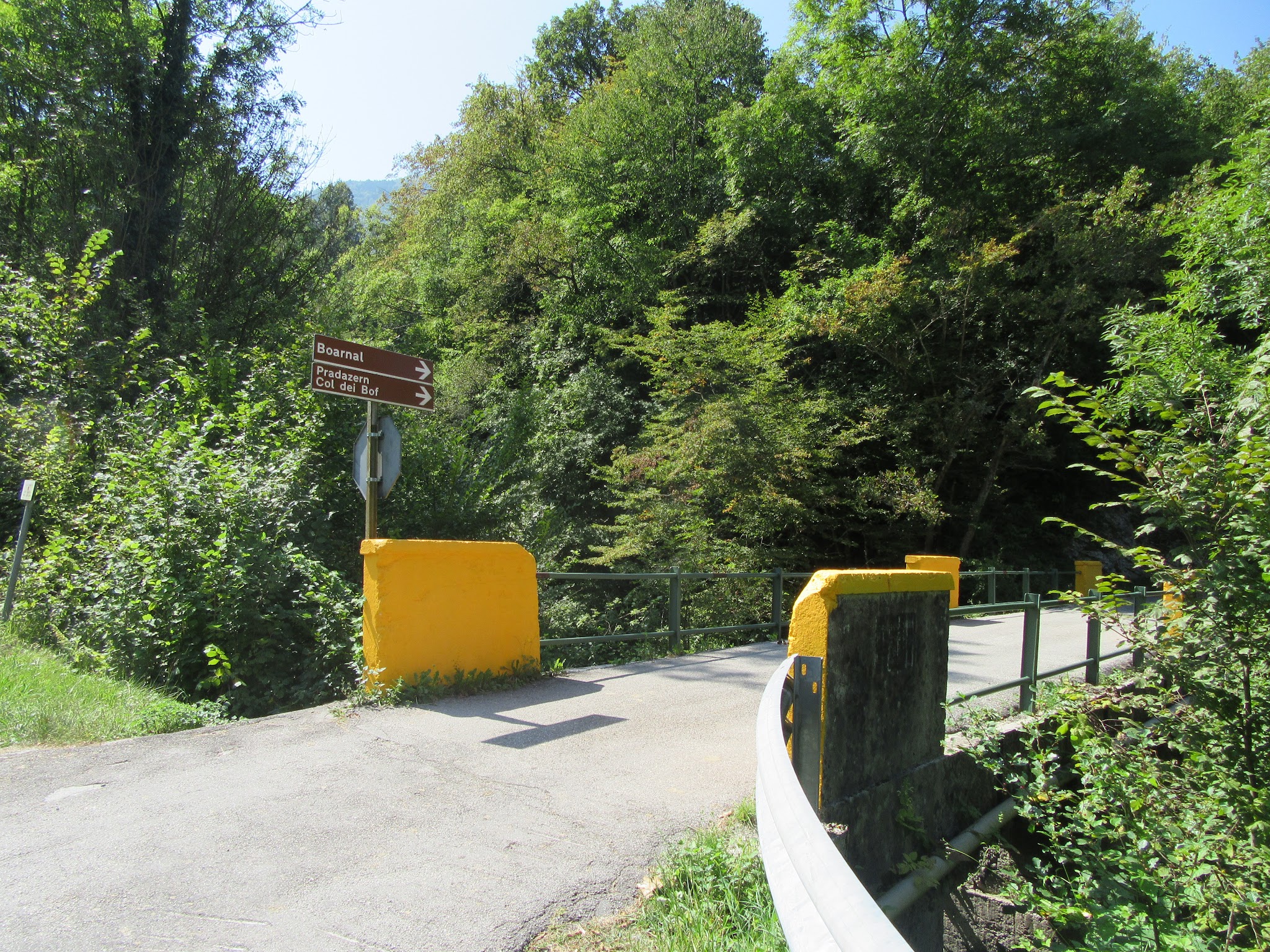 Cycling Monte Grappa from Seren - bridge and road at turn