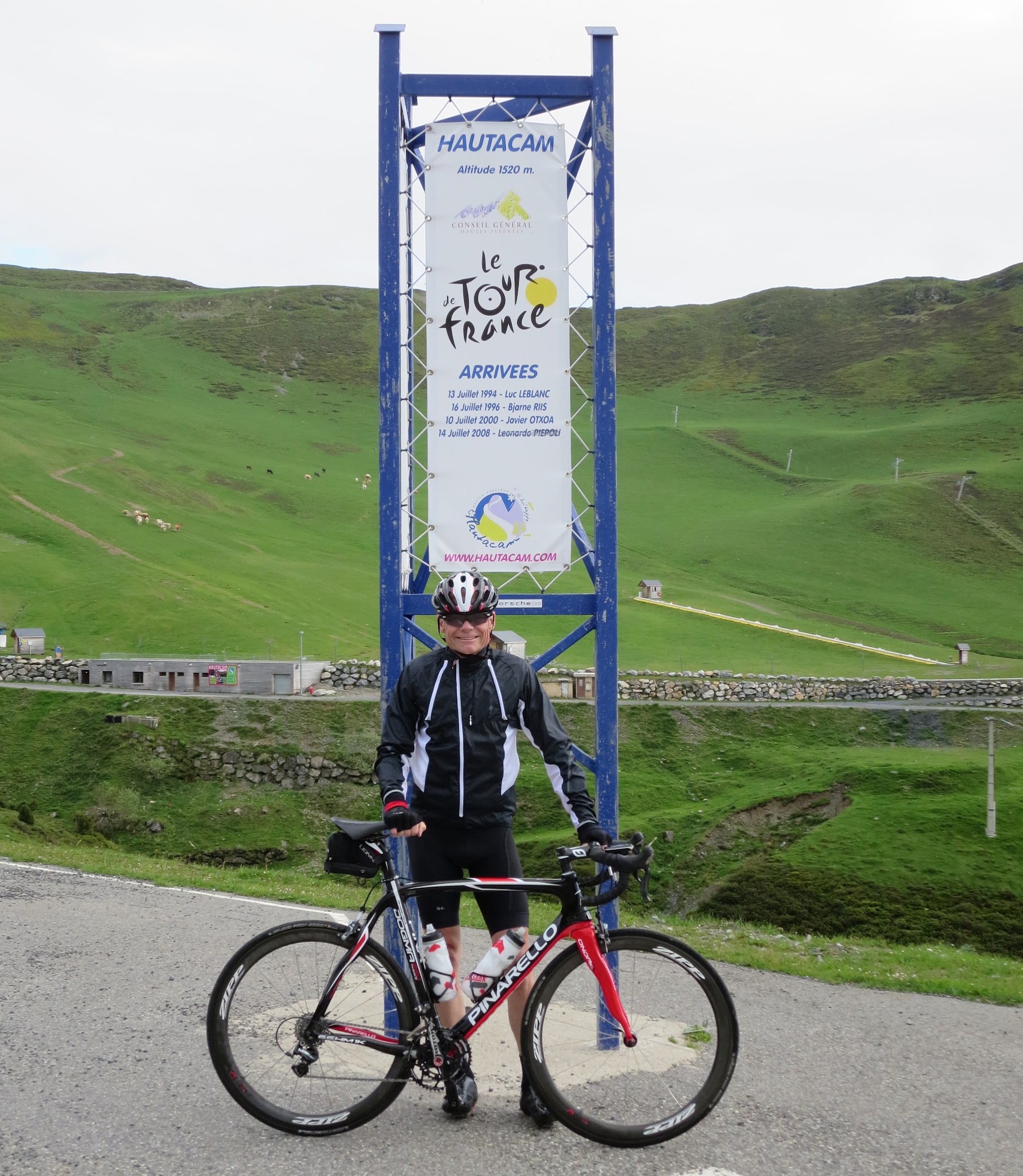 John Johnson with bike on Hautacam - Tour de France sign