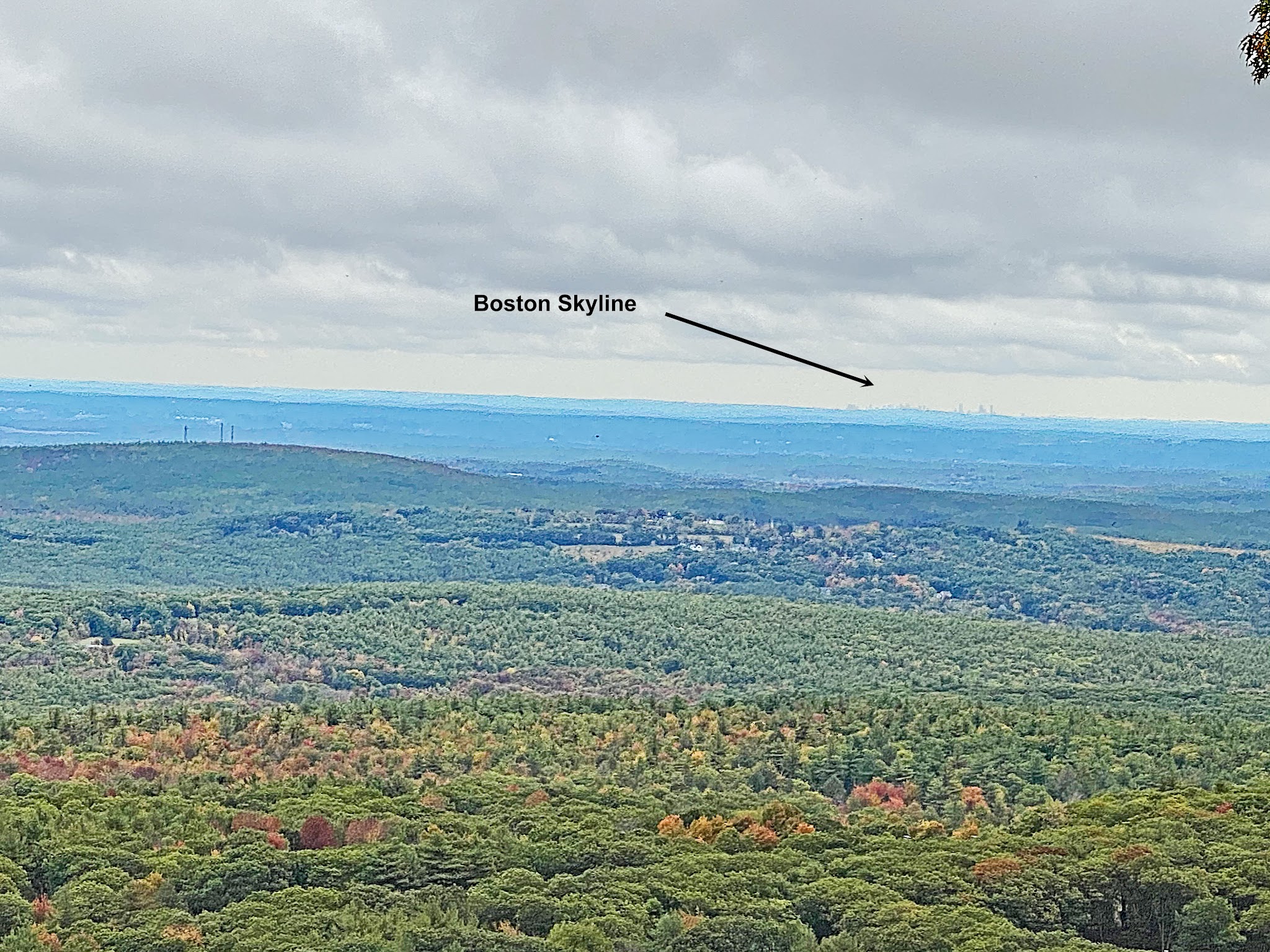 Cycling Wachusett Mountain East, Massachusetts Cycling Wachusett Mountain East, Massachusetts - view from Harlow Lookout shows dense forestation, fall colors, and the Boston skyline far in the horizon