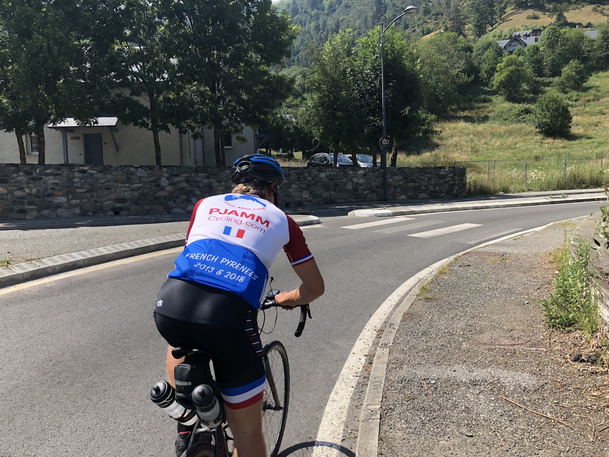 Climb by bike -  Col de Portet - Beginning of Climb - Vignec - cyclist riding bike
