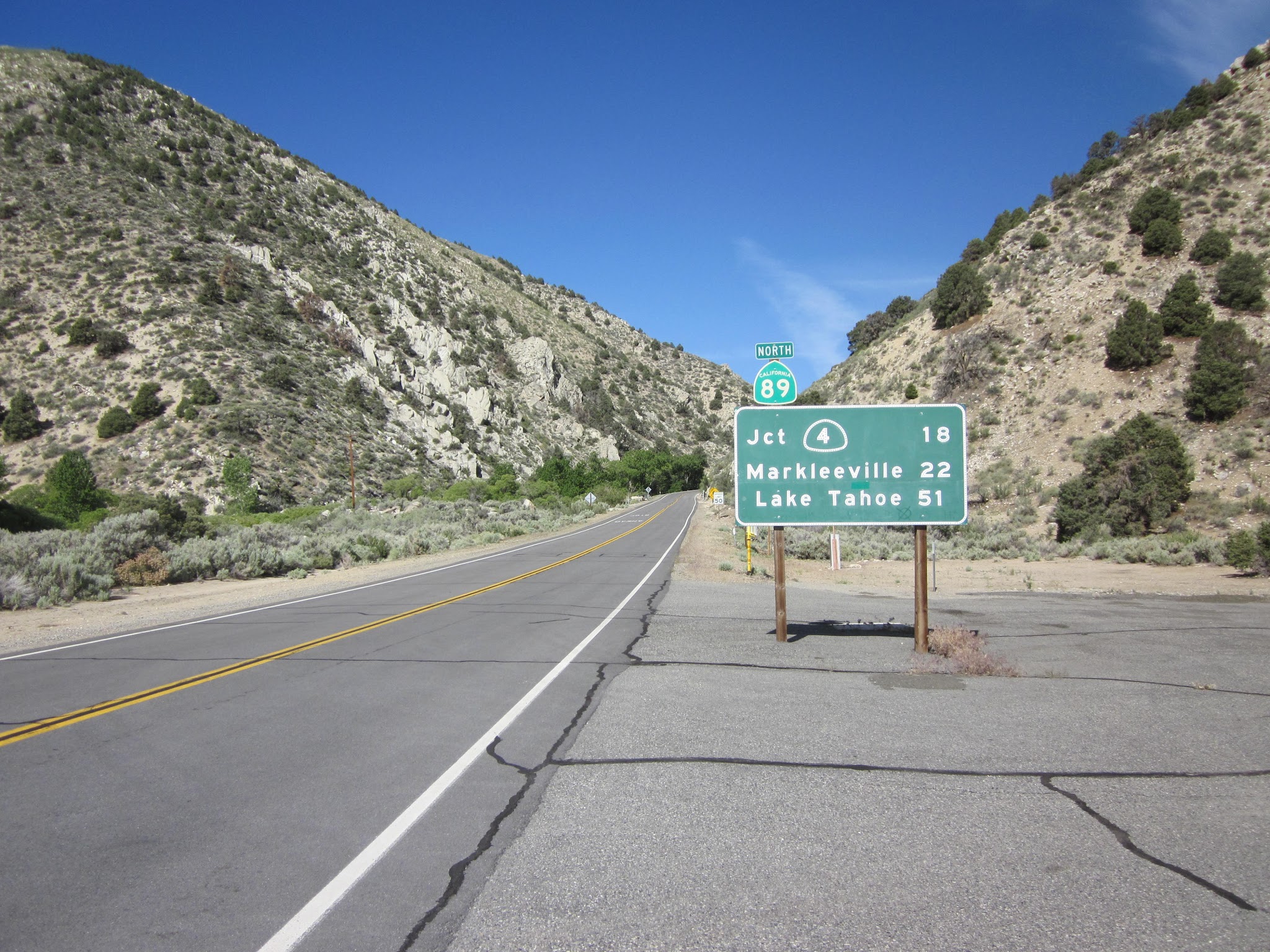 Climbing Monitor Pass East  by bike - beginning of climb - highway sign for Markleeville