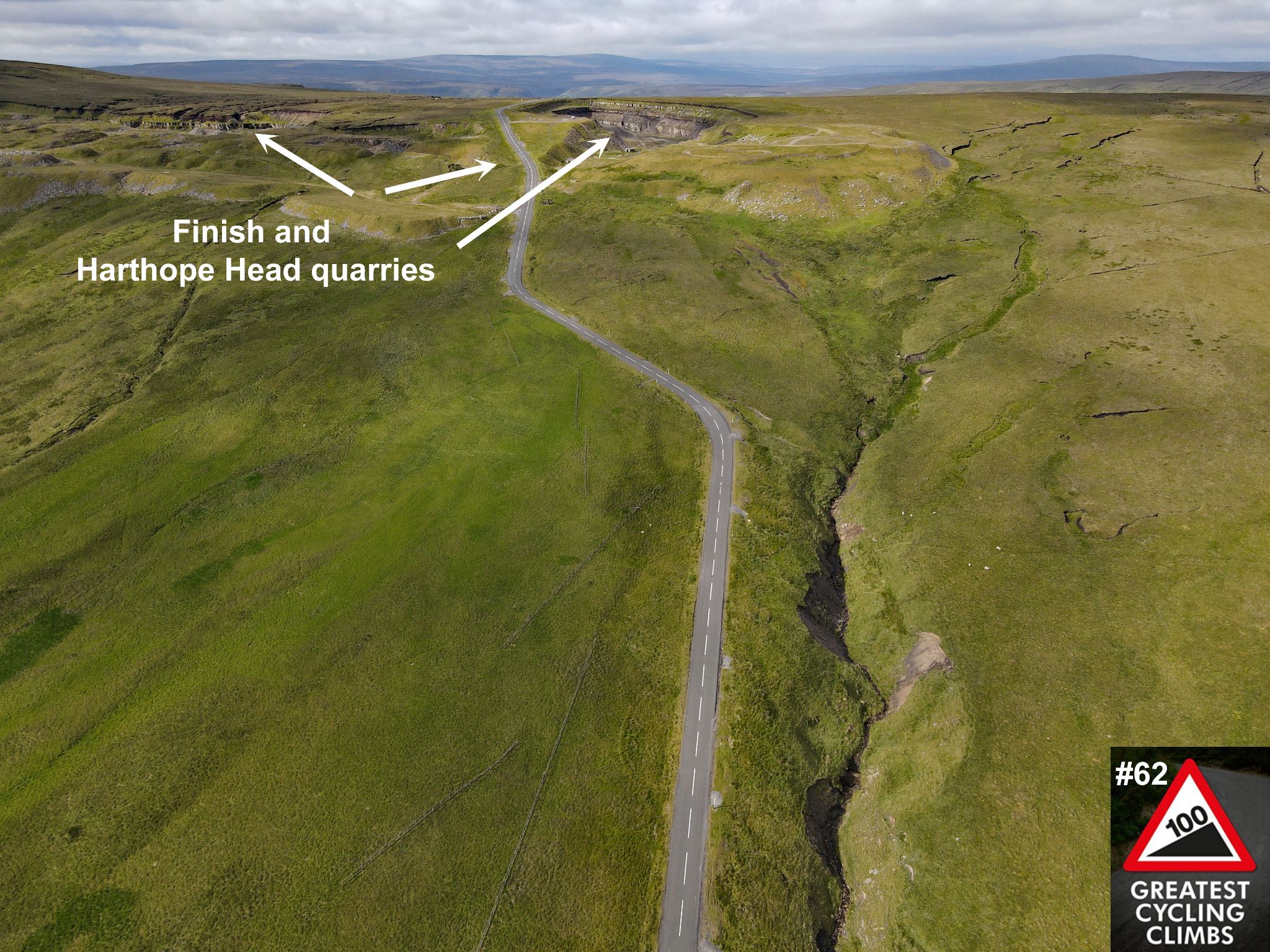 aerial drone view shows road cutting through green hillsides, picture points out Finish and Harthope Head quarries