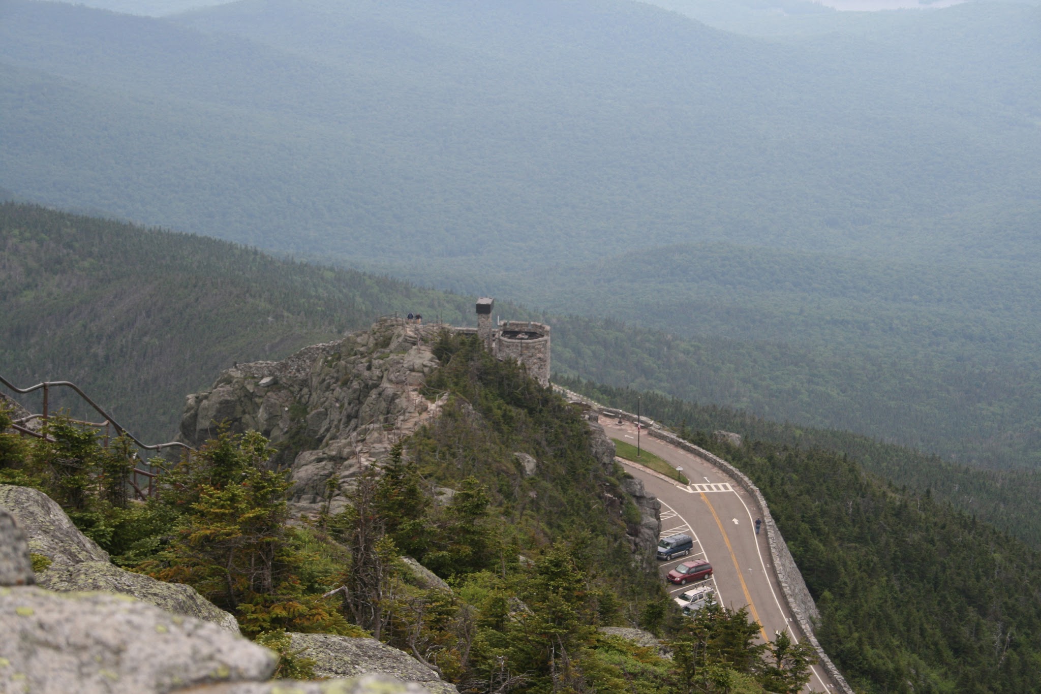 Whiteface Mountain Bike Climb Cycling Whiteface Mountain by bike - view from above of road leading up to small stone castle at the summit of Whiteface Mountain