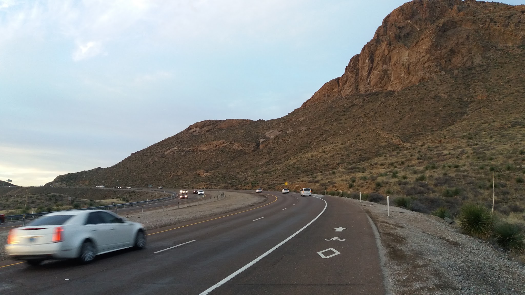 Cycling Smugglers Pass East - Transmountain Drive - bicycle marker painted on roadway shoulder