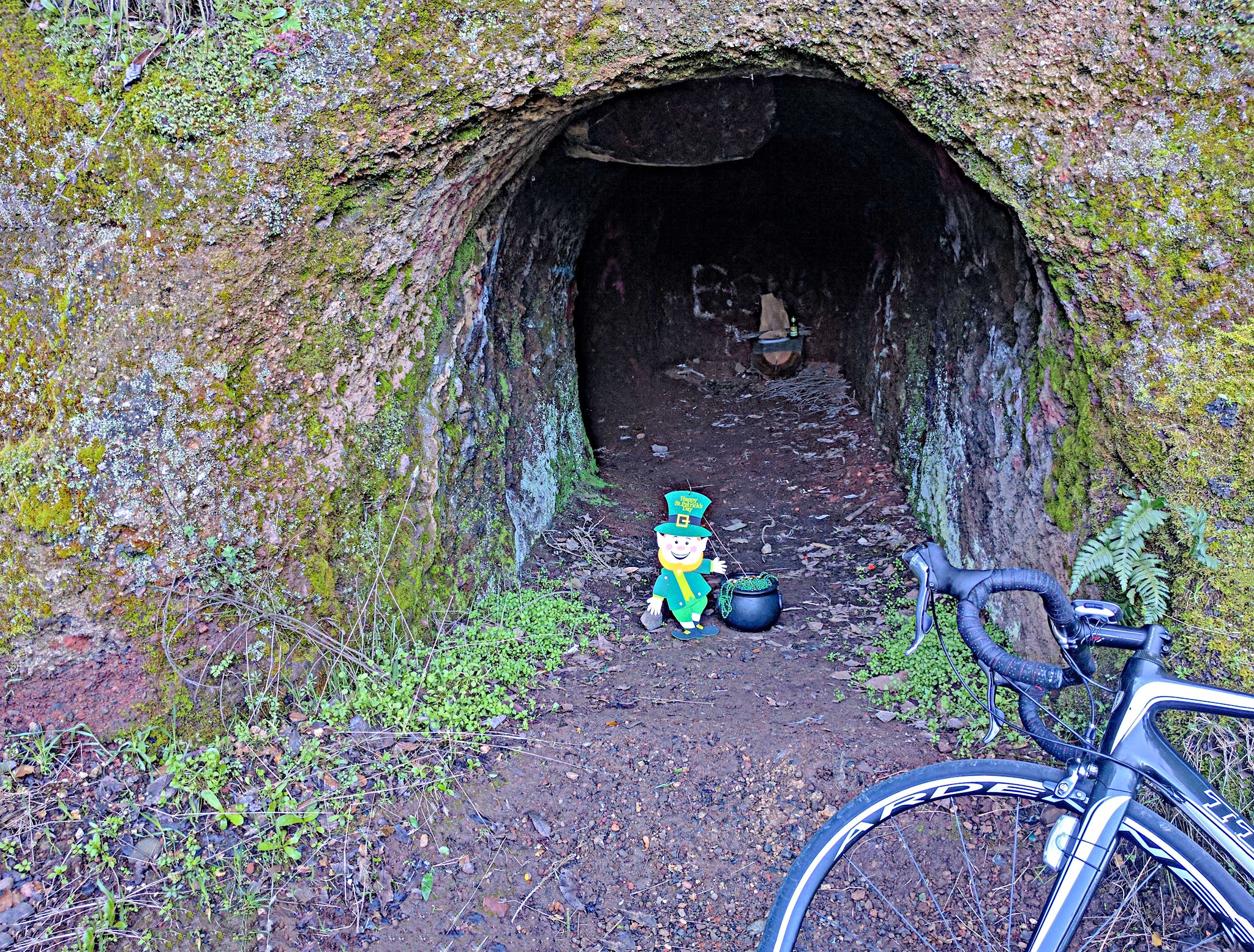 Cycling Cavedale Road - cave with leprechaun 