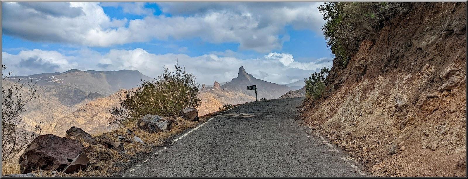 narrow, one-lane mountain roadway in bad shape