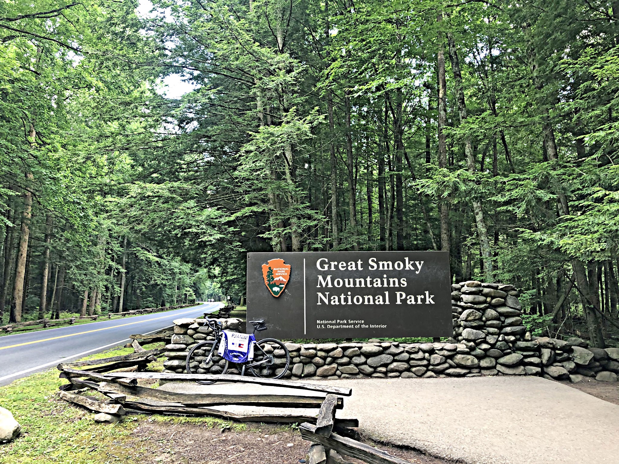 Cycling Clingmans Dome, North Carolina - bike parked next to NPS sign for Great Smoky Mountains National Park