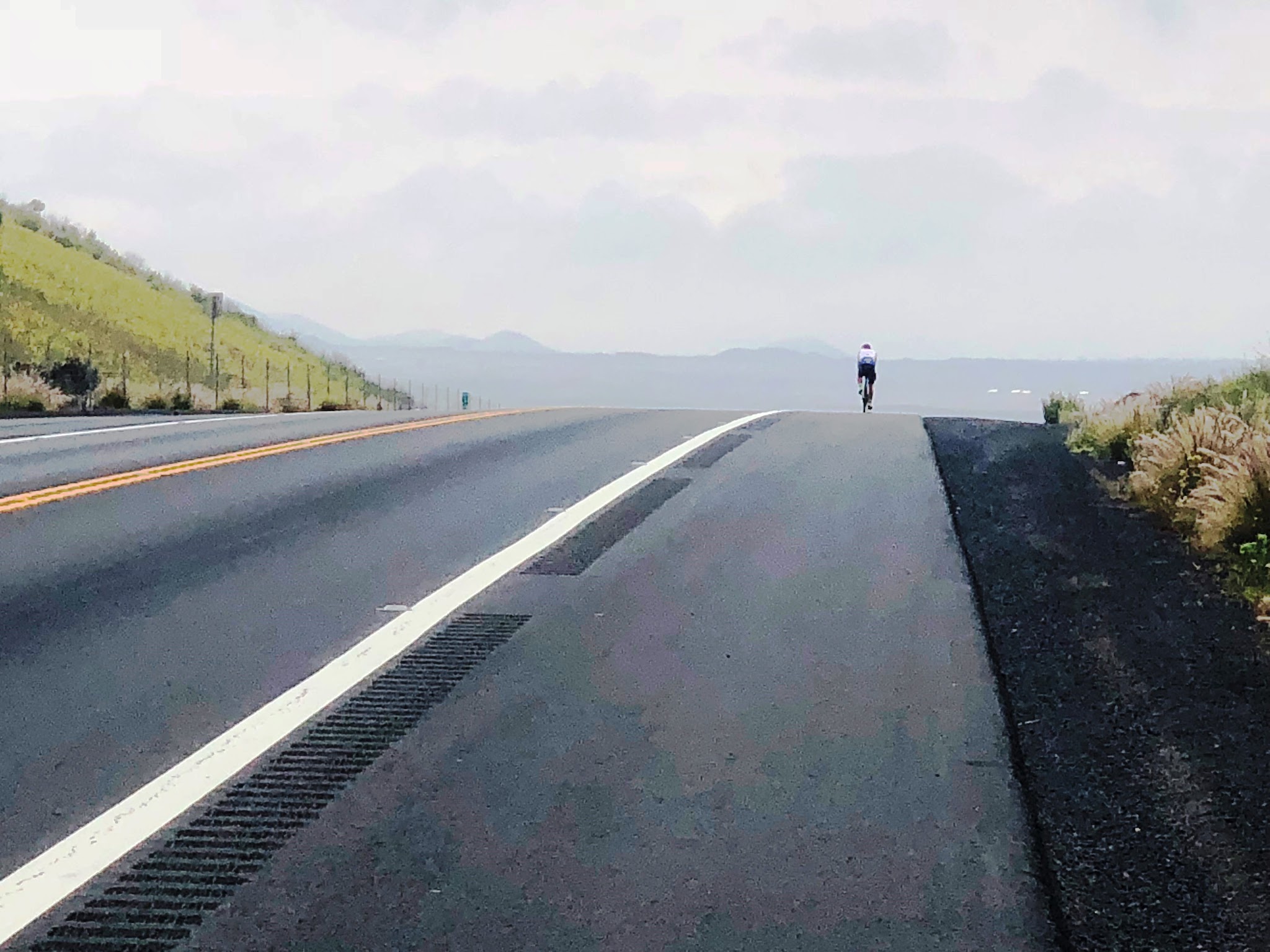 Bike climb Mauna Loa - Cyclist on Hwy 200 - Saddle Road