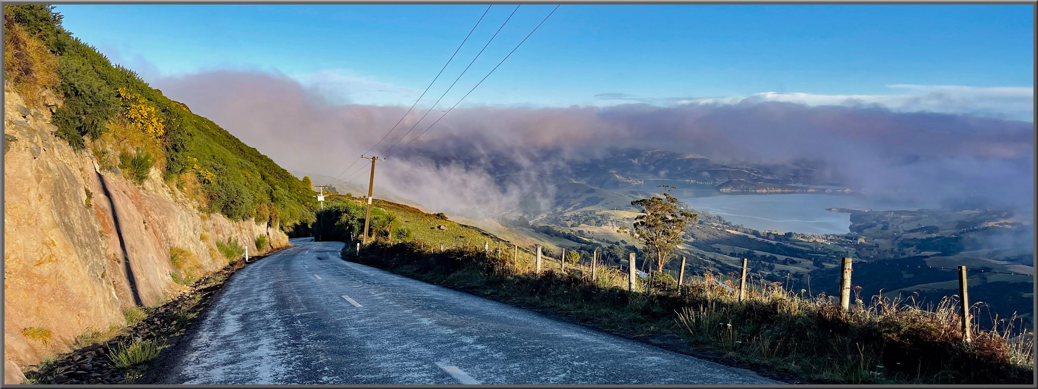 narrow two-lane roadway on hillside, Summit Road West