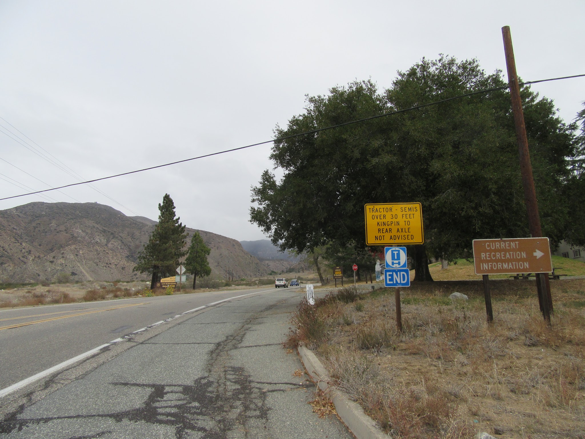 Start of Onyx summit bicycle climb - San Bernardino National Forest sign and visitor center entrance.
