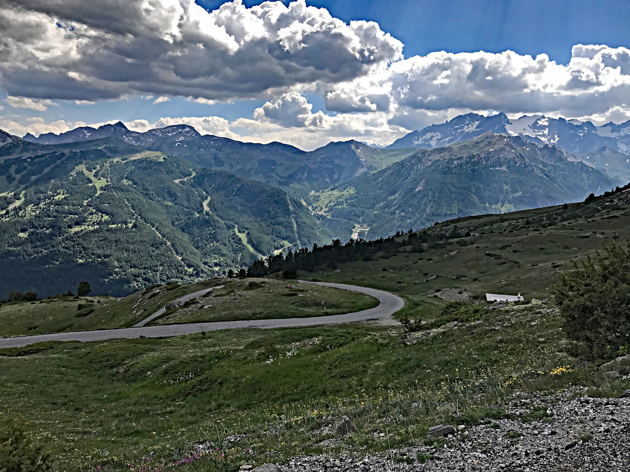 Cycling Col du Granon - switchback in foreground, ski runs in summertime in background