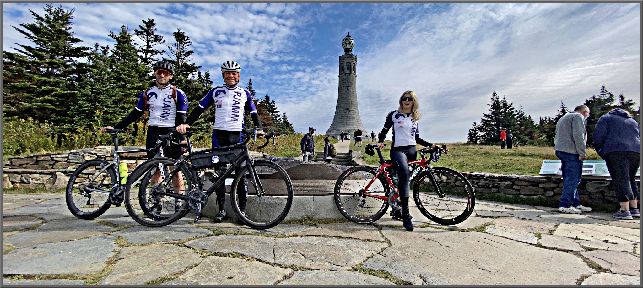 Cycling Mt. Greylock, Massachusetts  - PJAMM Cyclists stand with bikes in front of the Veteran's Memorial Tower