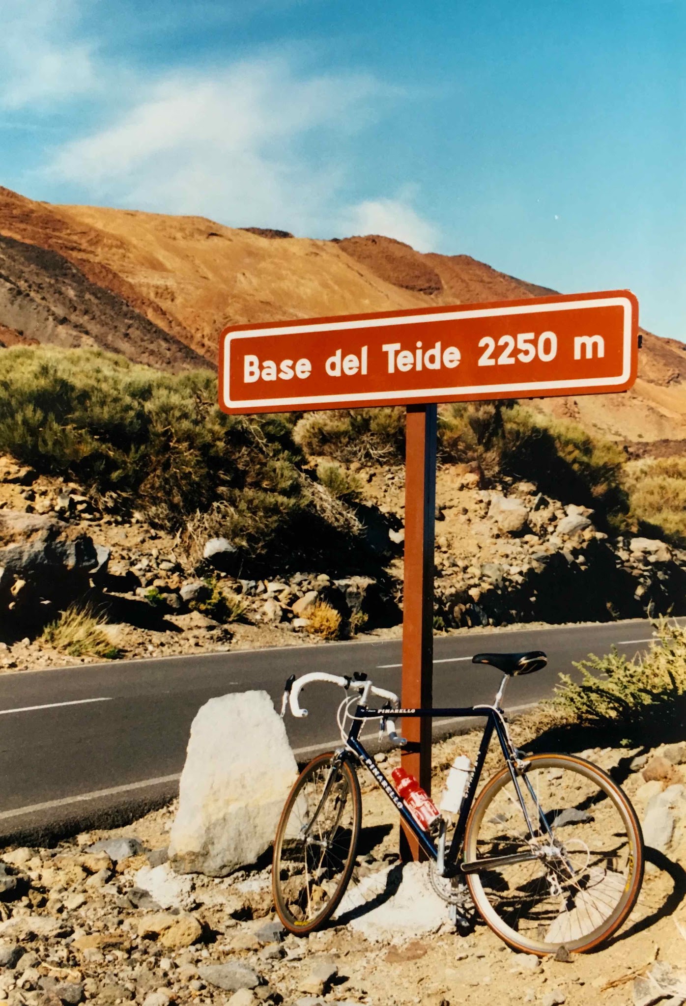 Climbing the longest bike climbs in Europe - Base del Teide sign with bike leaning against it.