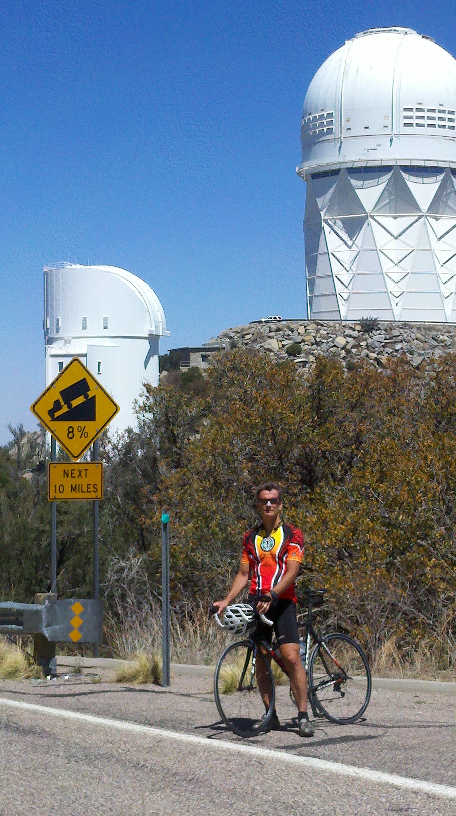 Biking Kitt Peak - cyclist at steep grade sign