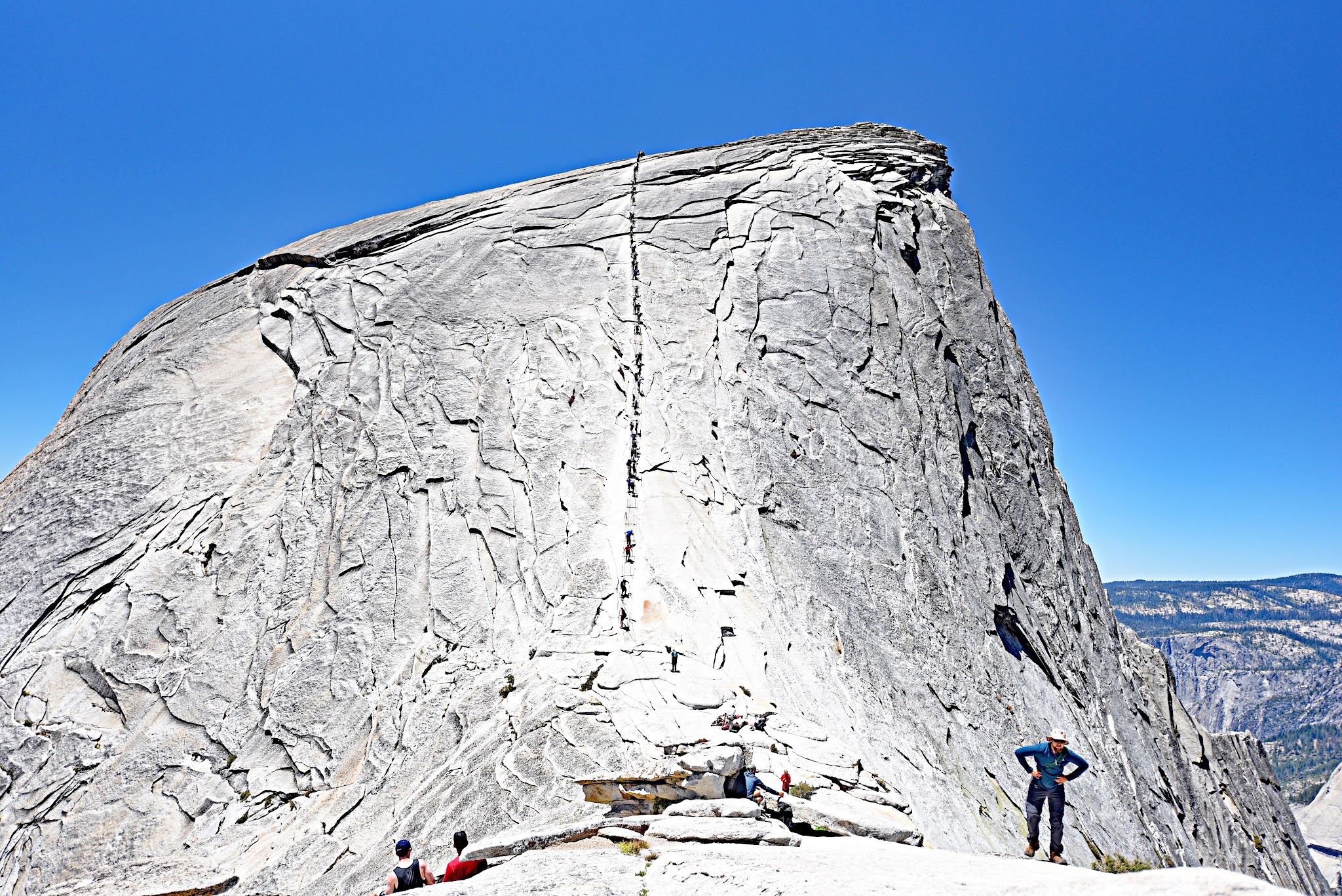 Bike - Hike Yosemite Valley to Glacier Point to Half Dome - hikers climbing Half Dome using cables