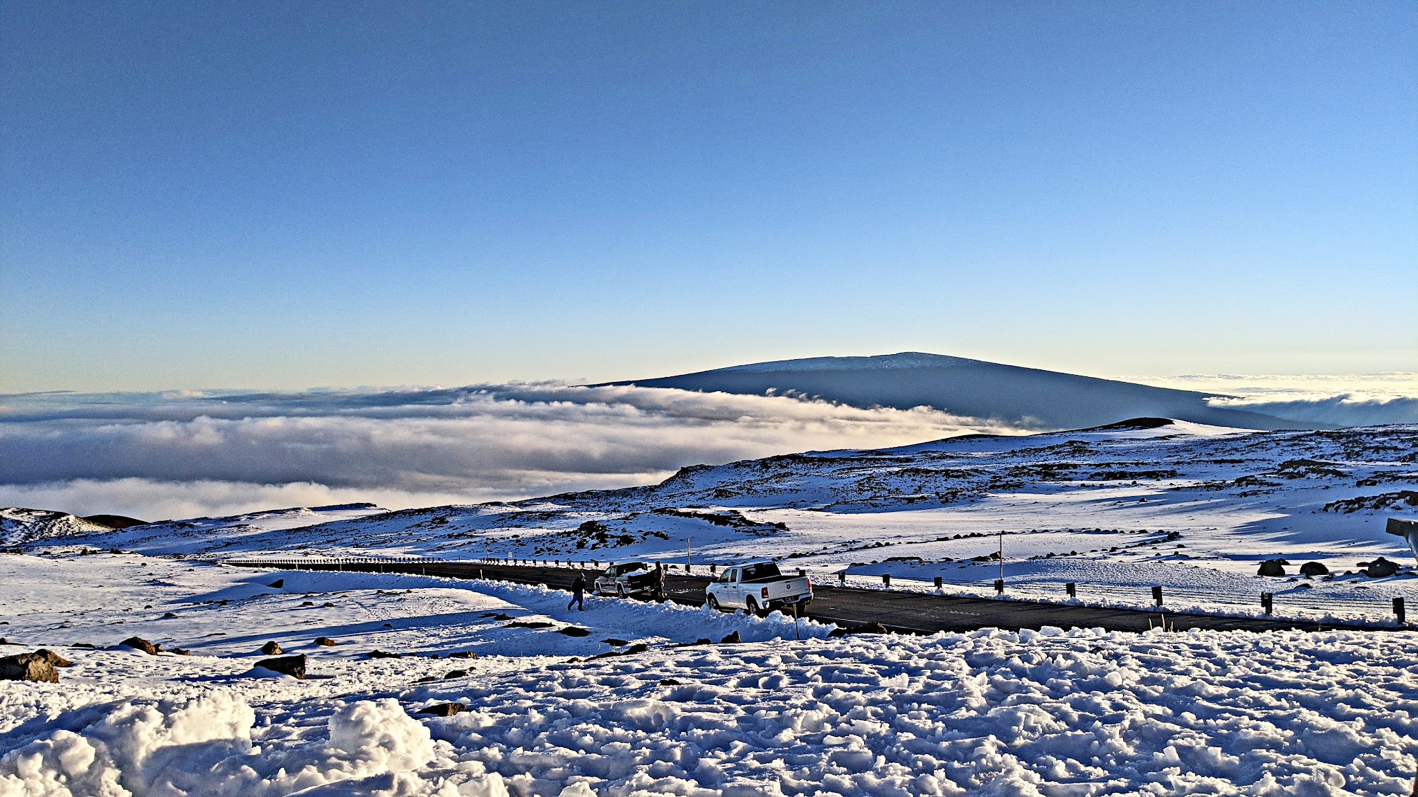 snow at the top of Mauna Kea in 2020, with Mauna Loa in the background