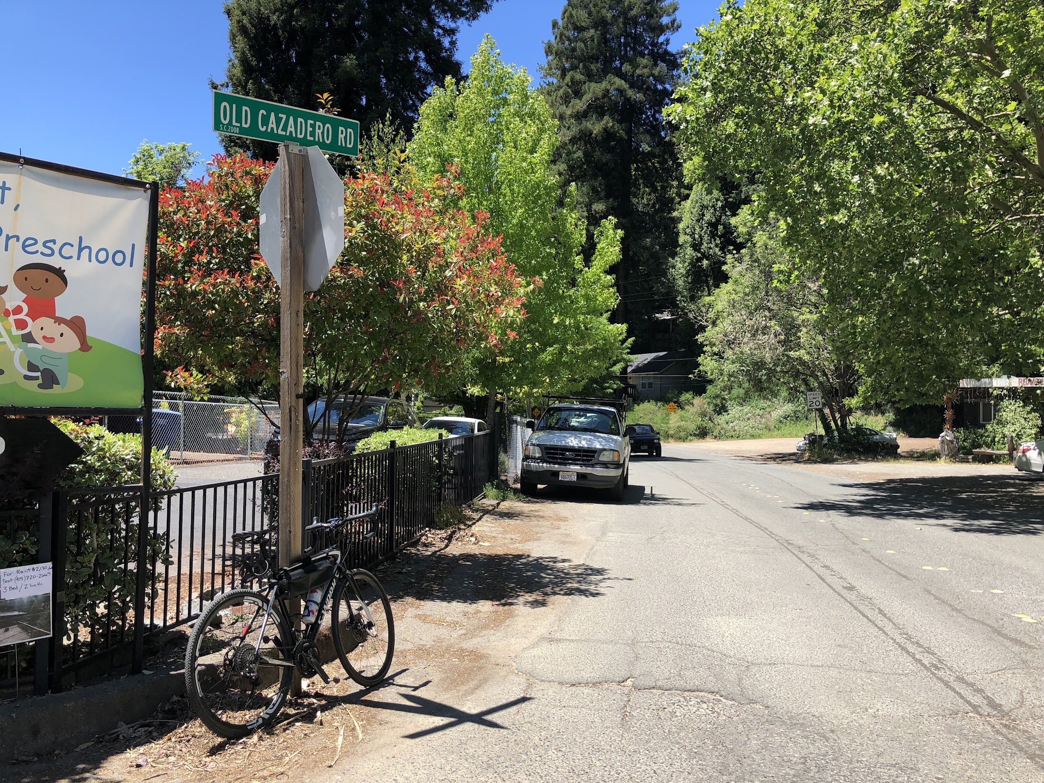 Bike climb Old Cazadero Road  - bike leaning against road sign
