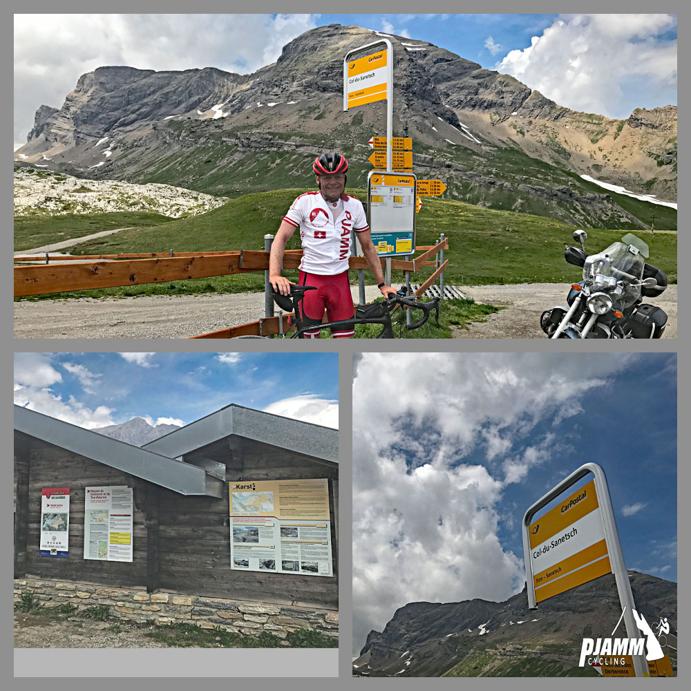 Cycling Sanetsch Pass, Switzerland - climb finish at Sanetsch Glacier, PJAMM cyclist John Johnson standing with bike at top of climb, visitor center