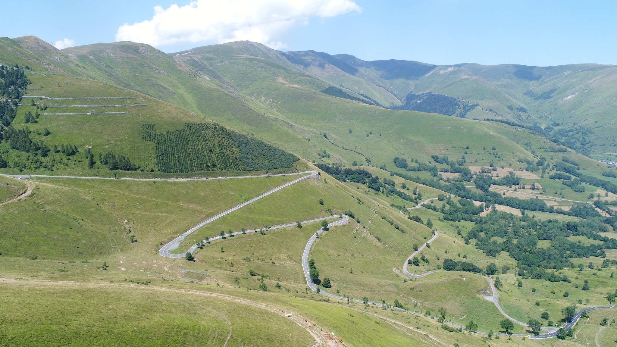 Biking Col de Peyresourde from Bagneres-de-Luchon - aeriial drone photo of switchbacks and hairpin turns at the top