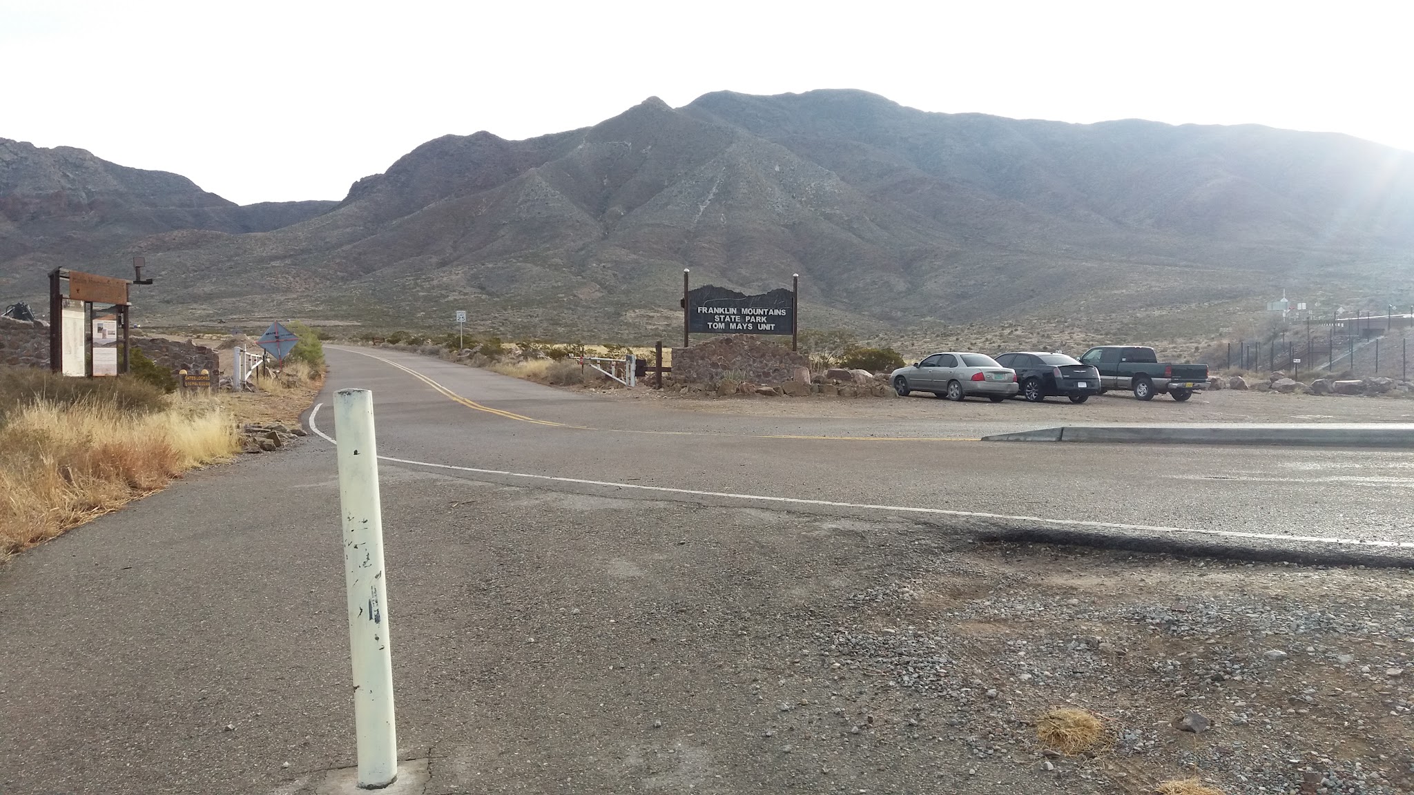 Cycling Smugglers Pass West - Transmountain Drive - Franklin Mountains State Park sign, mountains, roadway