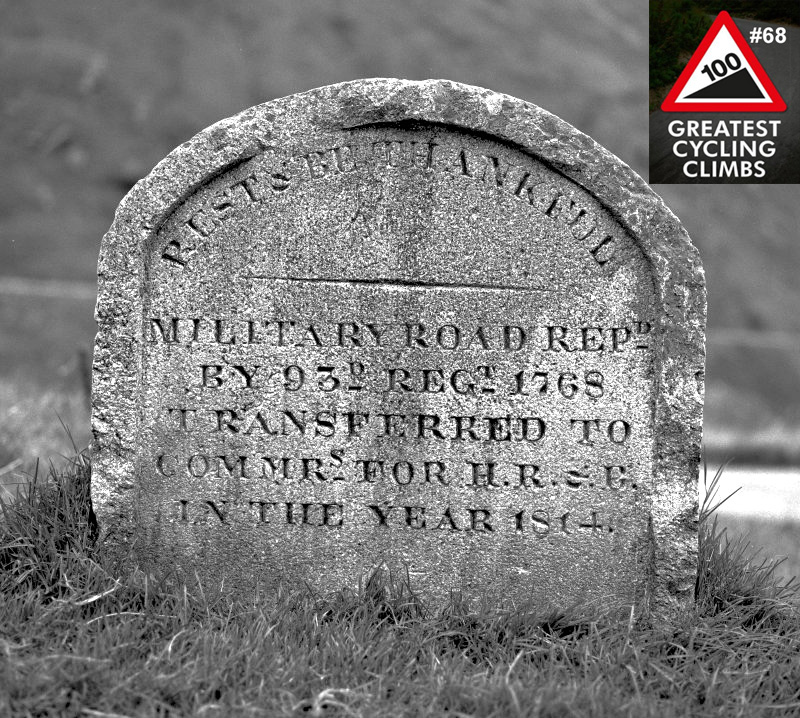 Cycling Rest and Be Thankful, Scotland Cycling Rest and Be Thankful, Scotland - black and white image of stone monument reading in part "Rest and Be Thankful Military Road Rep", 100 Greatest Cycling Climbs #68 image in corner
