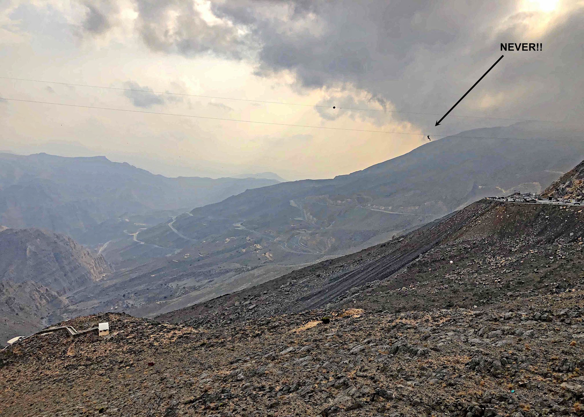 Jebel Jais, Ras Al Khaimah, UAE Jebel Jais, Ras Al Khaimah, UAE - zip line can be seen traversing gorge down the mountainside, longest zip line in the world