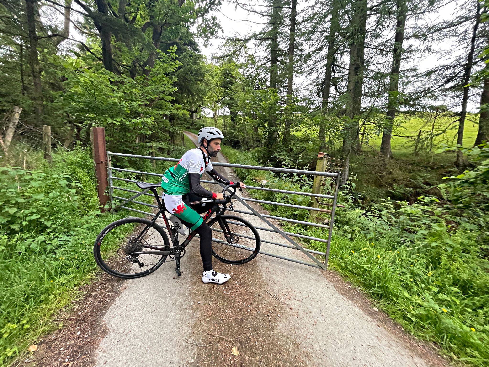 PJAMM Cyclist closes livestock gate behind him