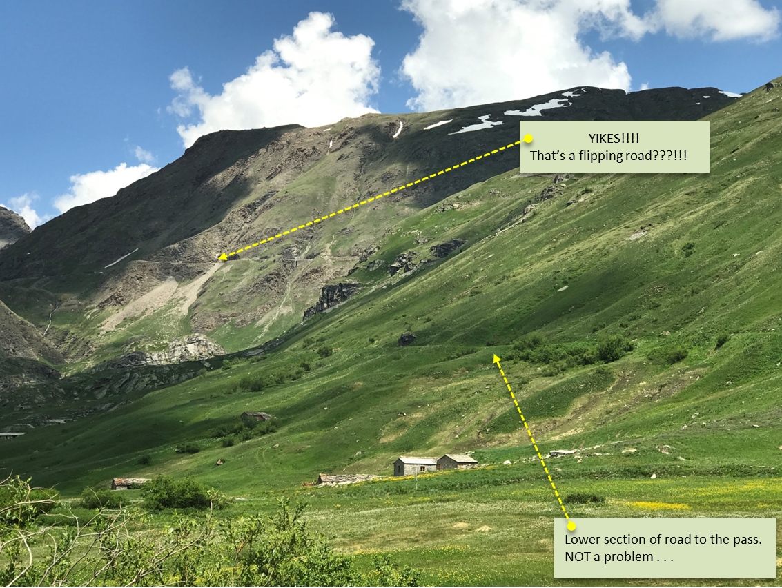 Cycling Col de l’Iseran - meadow, cliff, pass