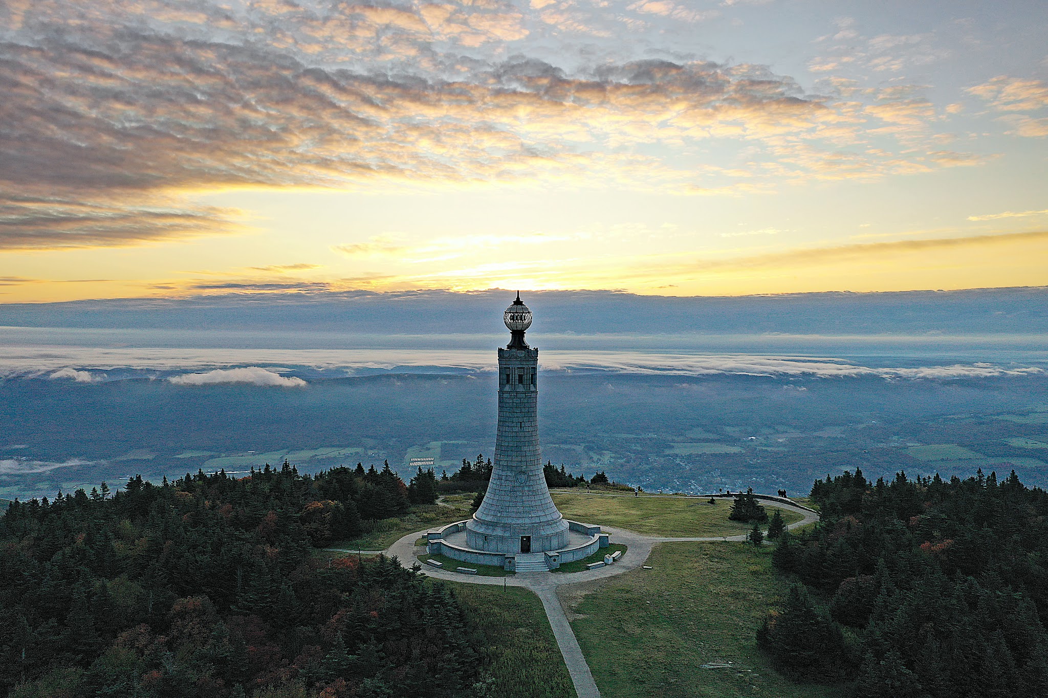 Cycling Mt. Greylock, Massachusetts - aerial drone view of Veterans Memorial Tower at climb's summit