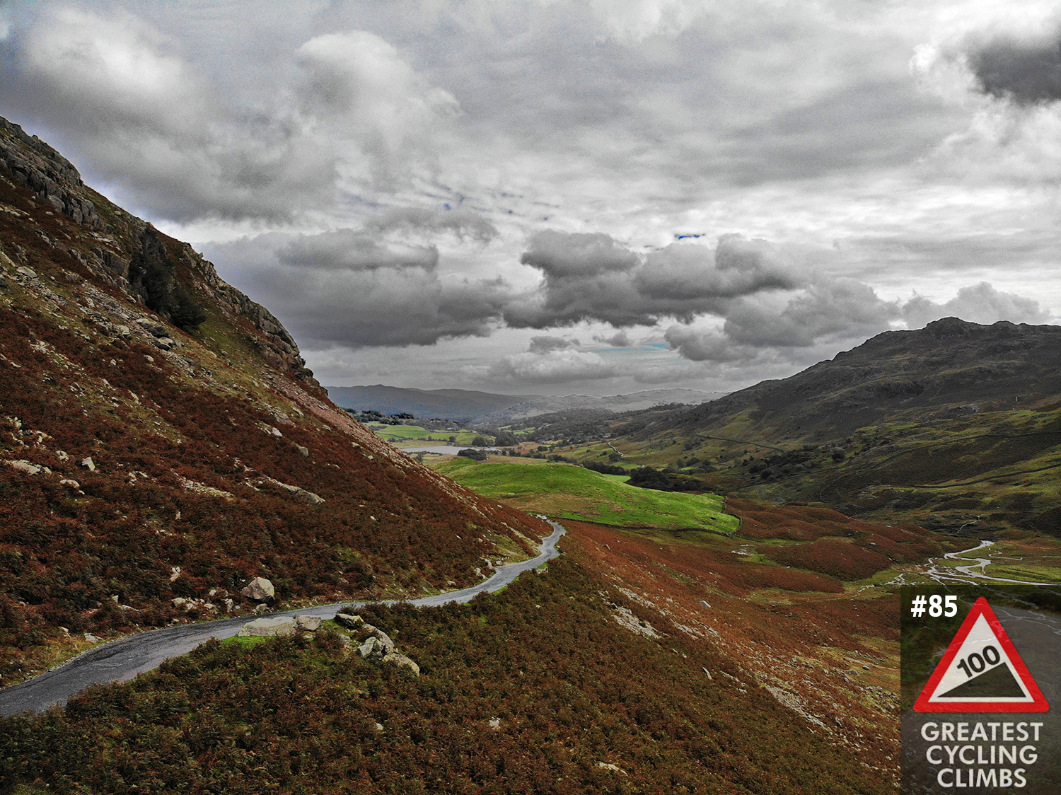 photo shows view down one-lane mountain roadway on foggy, wet day