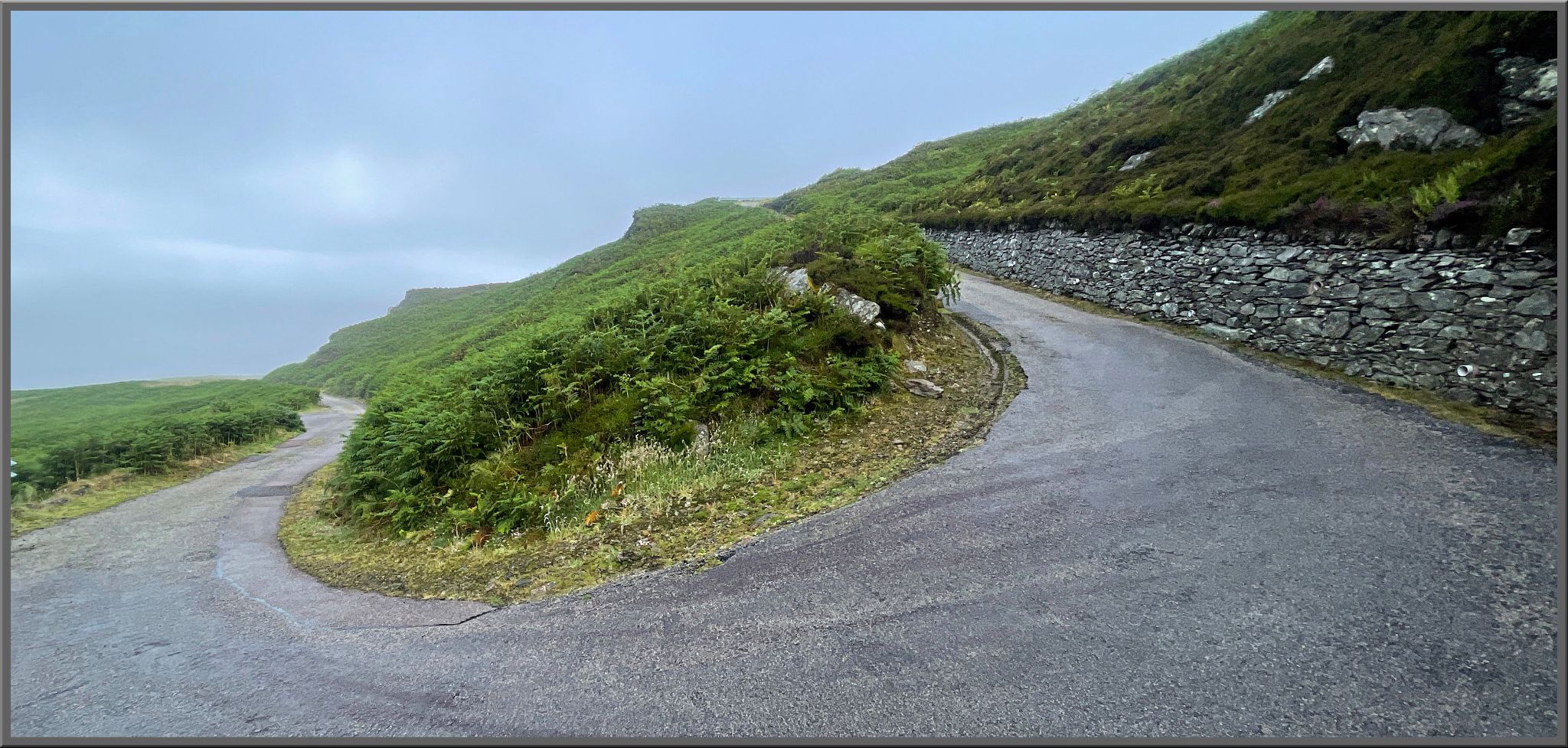 sharp U shaped turn in roadway at steep gradient